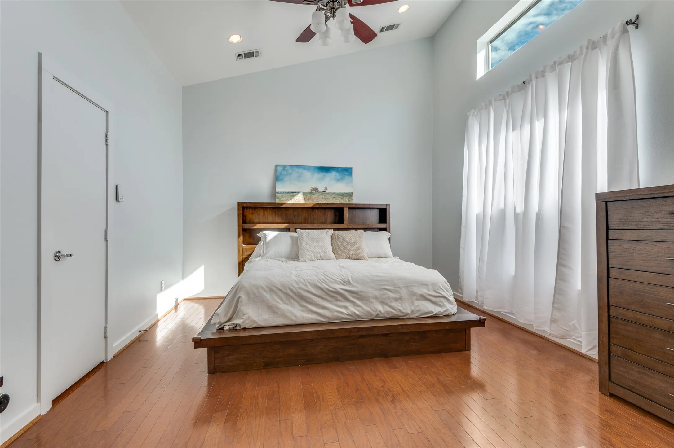 Primary suite featuring soaring ceilings, walk in closet, and spa inspired bath