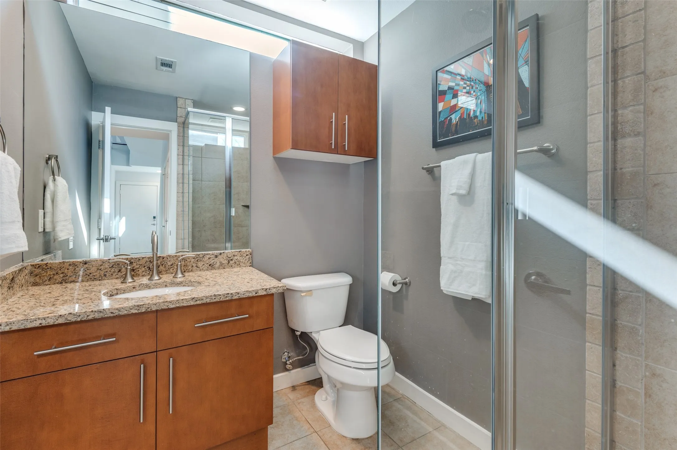 Versatile first floor flex space with full bath and walk in shower, offering guest suite or office potential