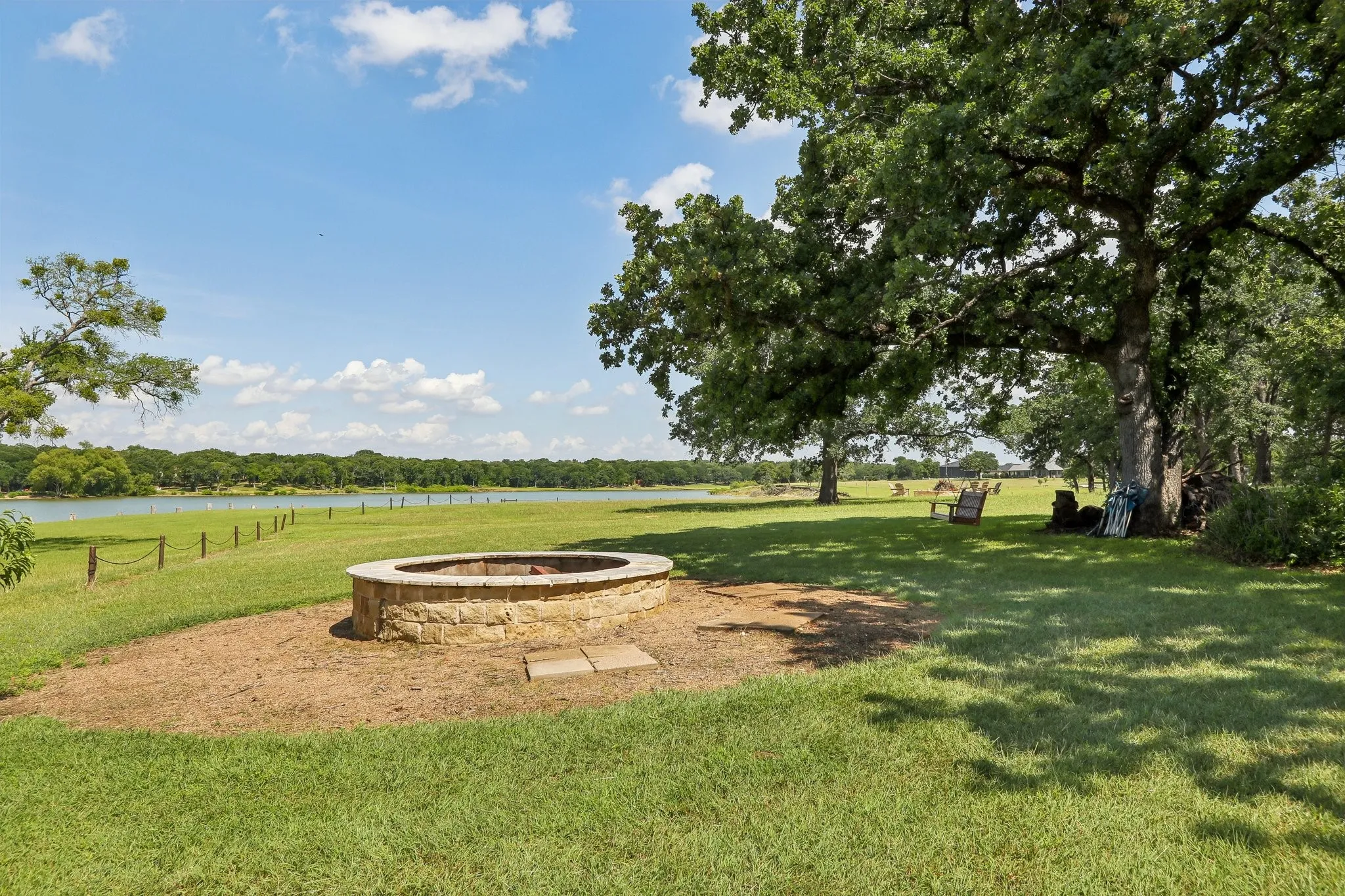 Lakeside firepit and swing