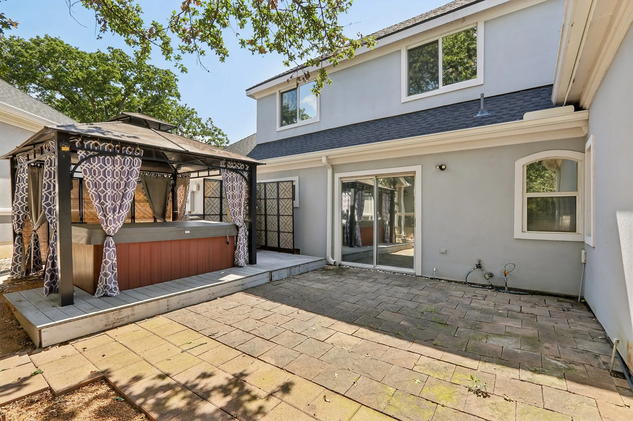 Side patio with hot tub