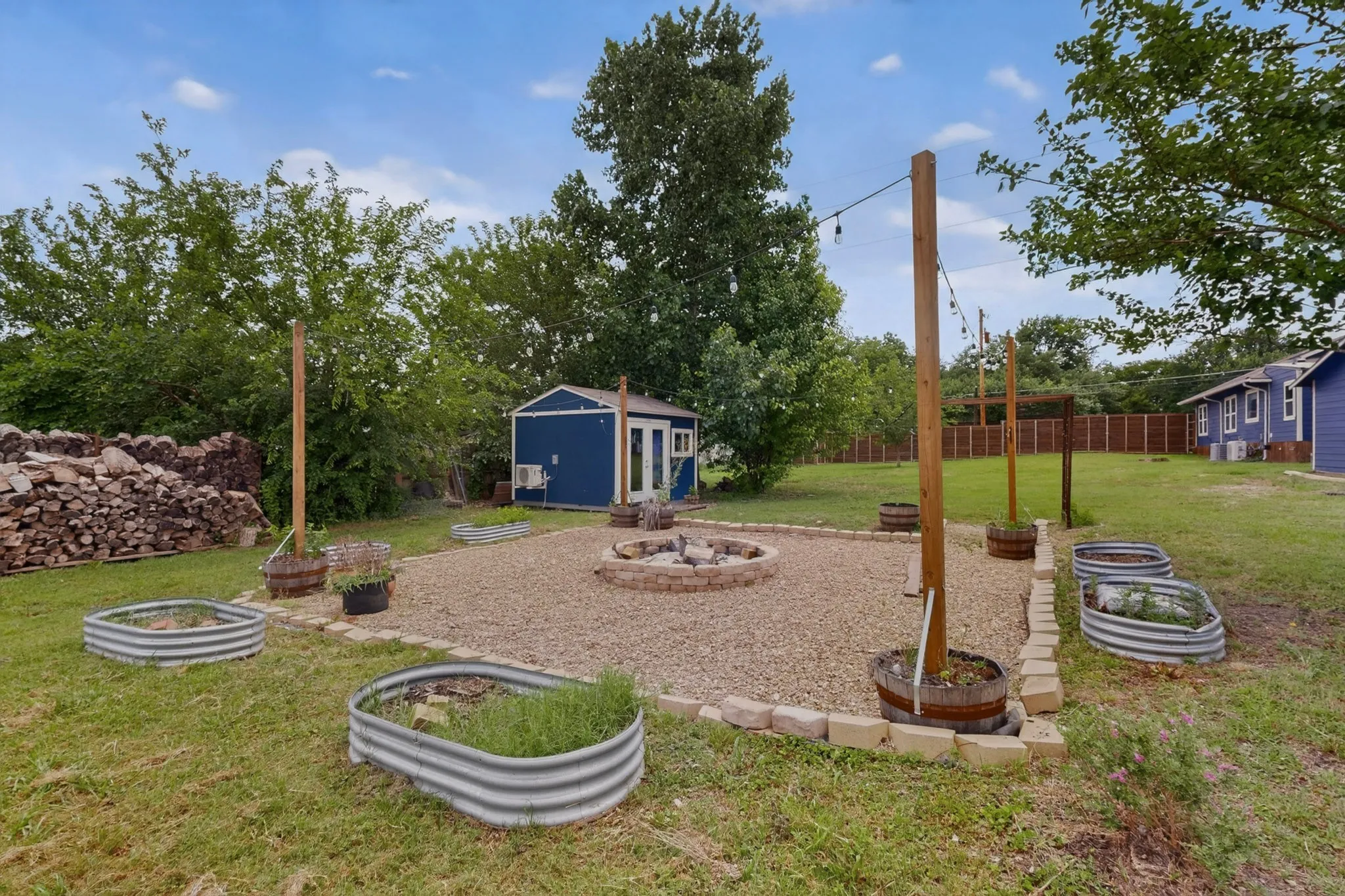 Expansive grass lawn bordered by a wood fence