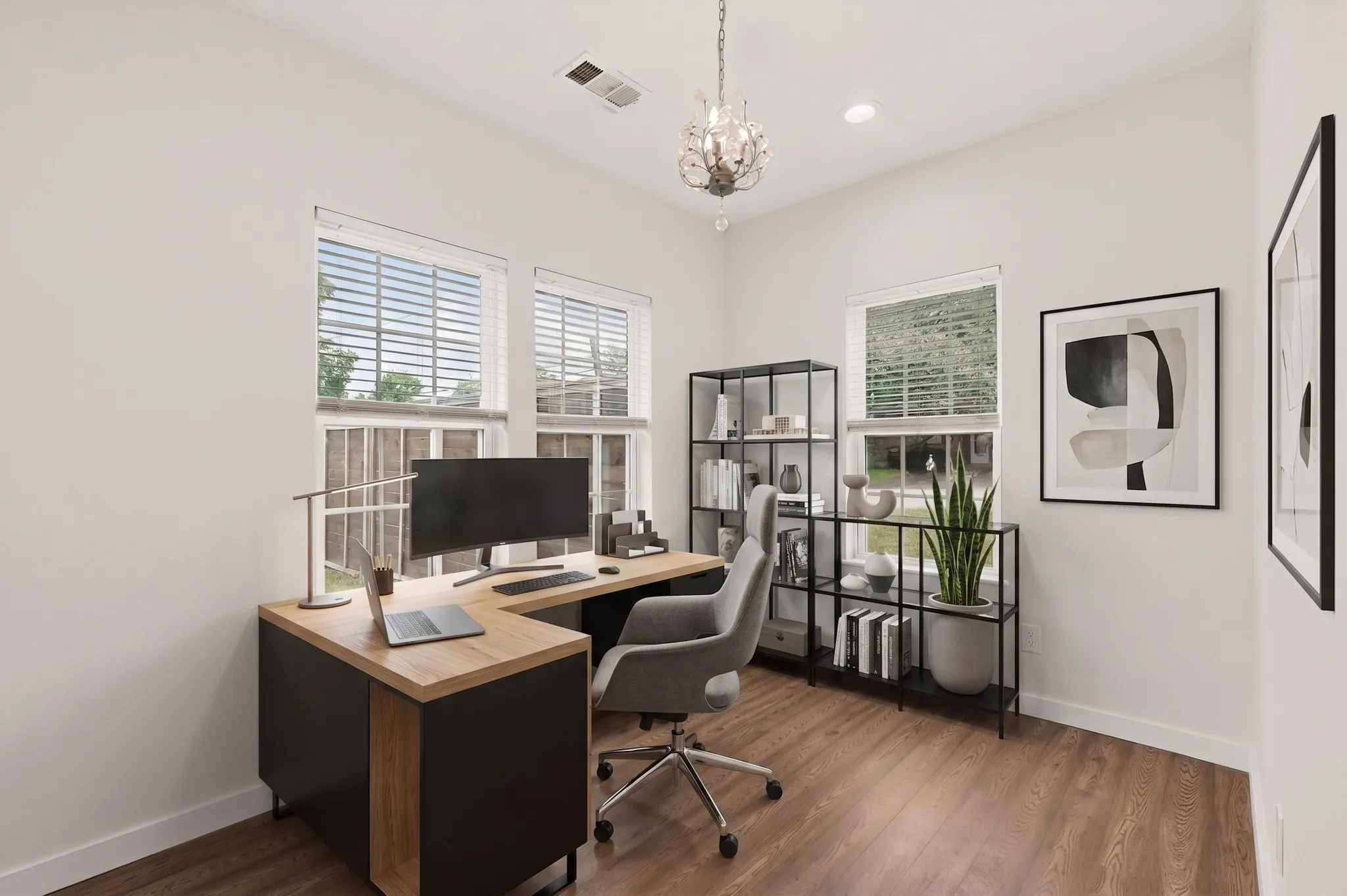 Virtually Staged office or second bedroom Dedicated office space featuring two windows with horizontal blinds, wood-finish flooring, and a decorative chandelier