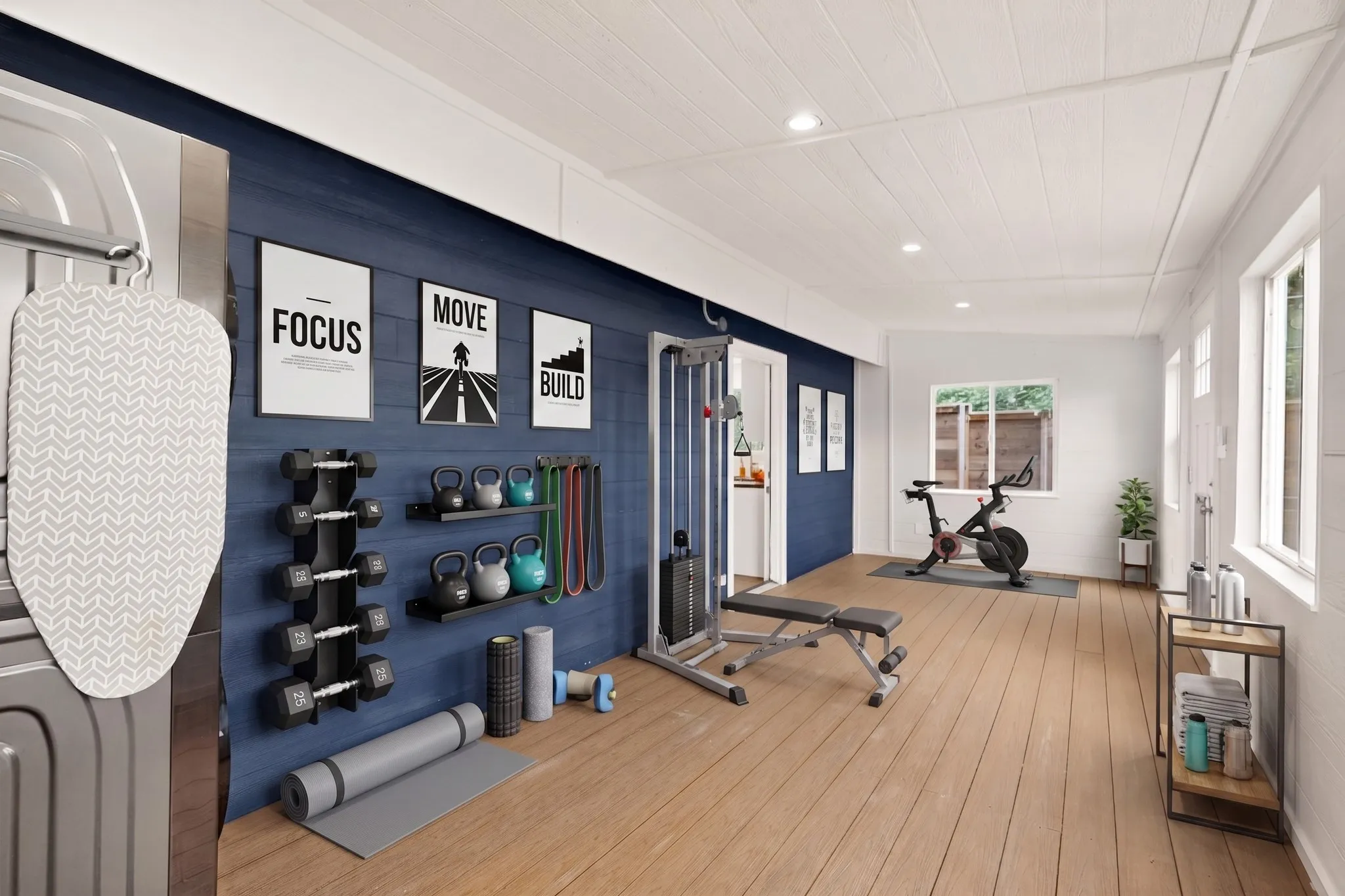 Virtually Staged Dedicated fitness area featuring wide plank wood-finish flooring, recessed lighting, and bright white walls
