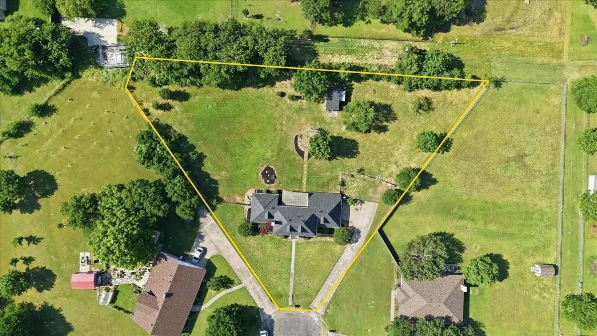 Expansive green lawn surrounding a residential property