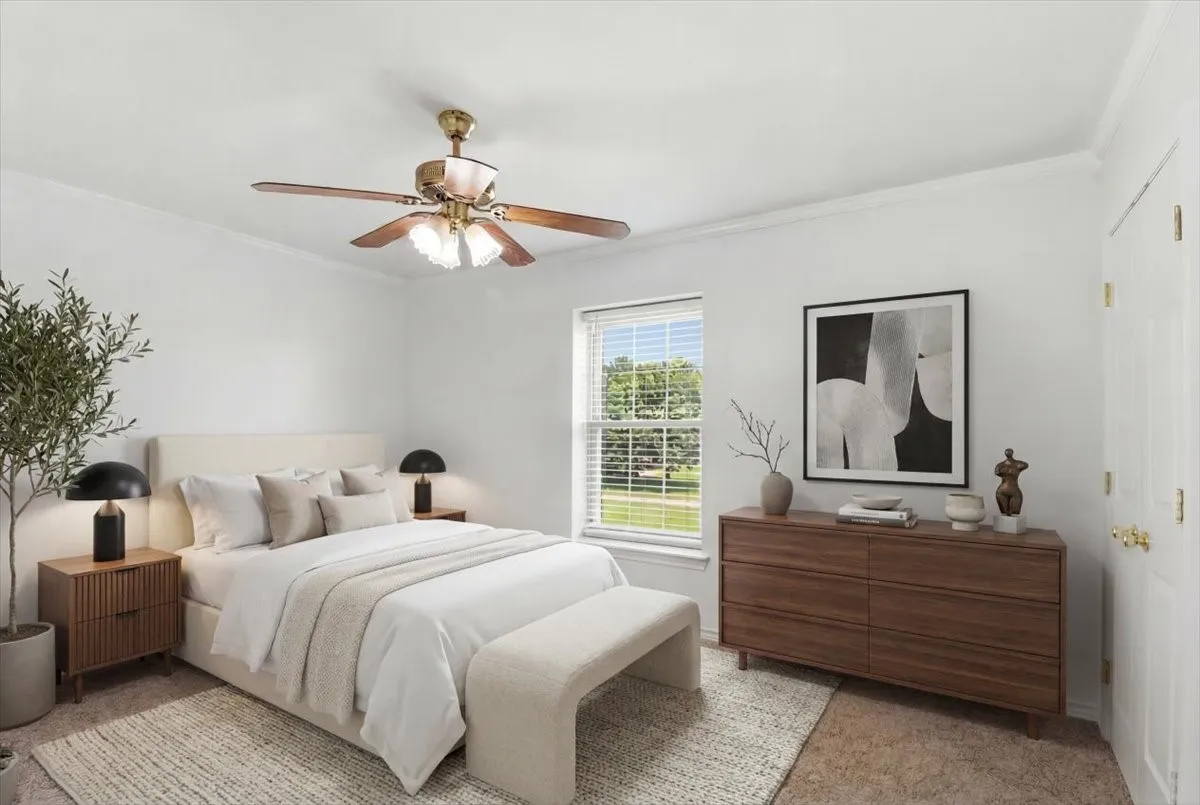 Third bedroom featuring crown molding, a ceiling fan with light fixture, and a window with blinds overlooking front lawn