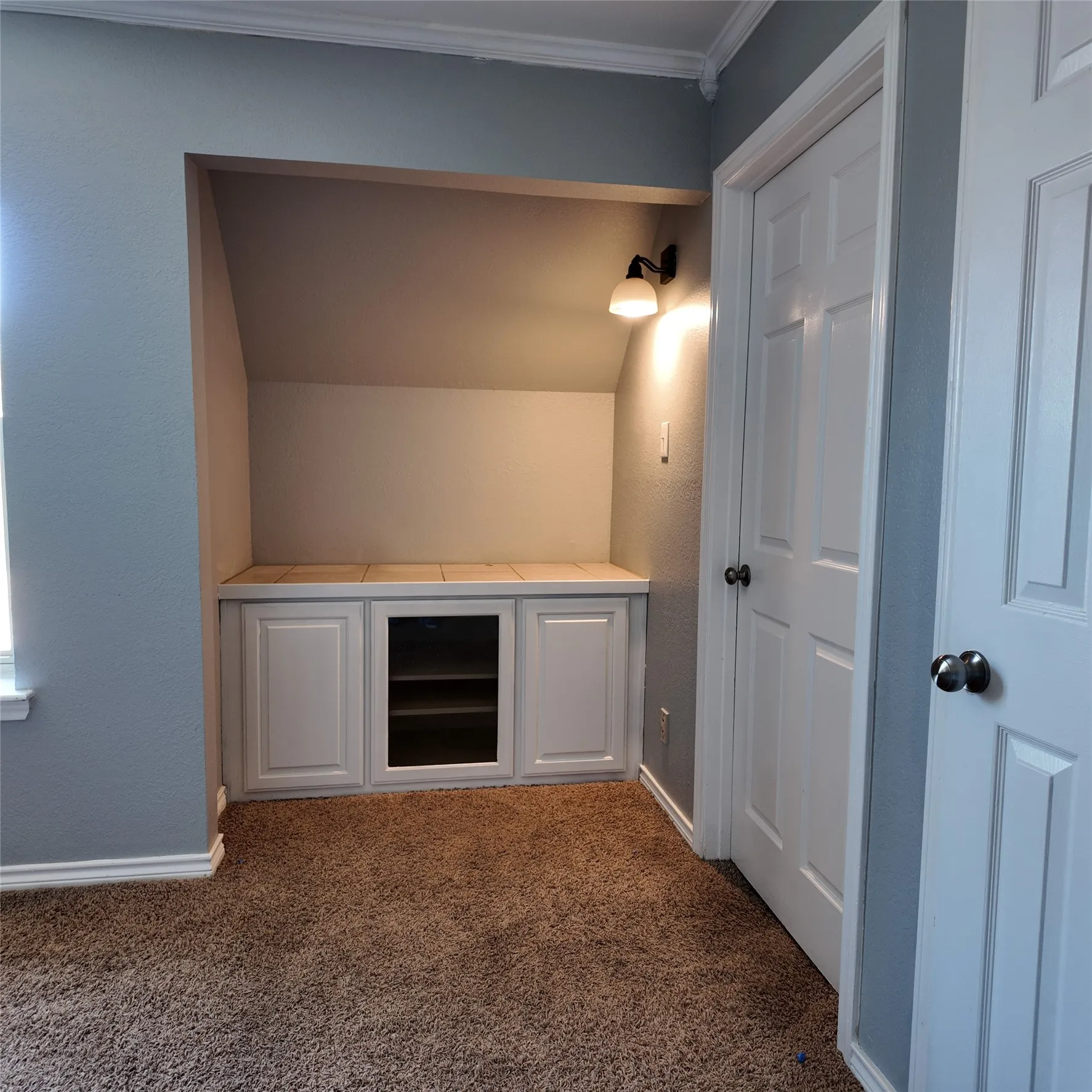 Built-ins in the flex room/game room. The cabinets are now painted white.