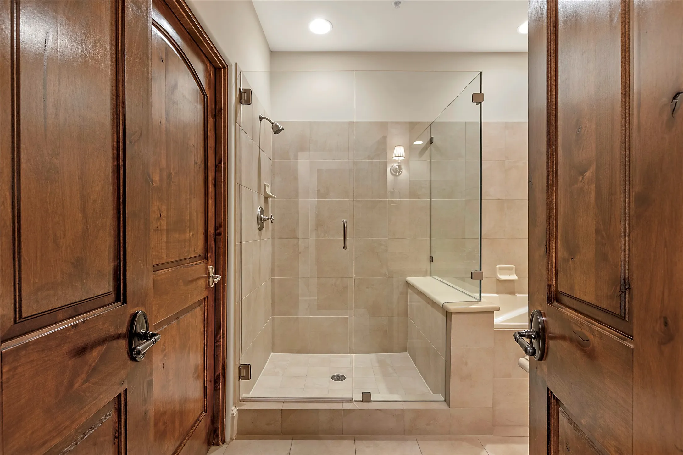 Bathroom featuring tile patterned flooring and an enclosed shower
