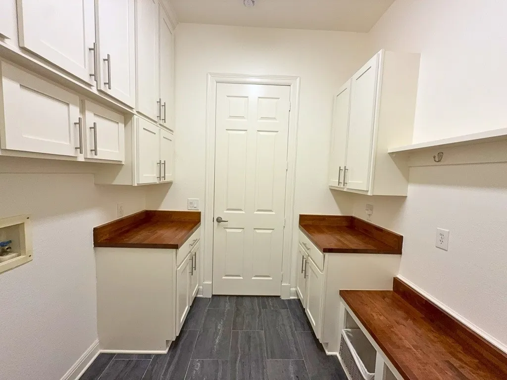 Laundry room with built-in cabinetry