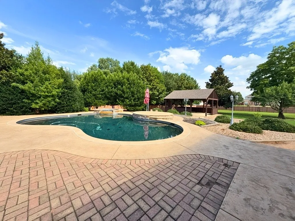 Swimming pool with raised spa