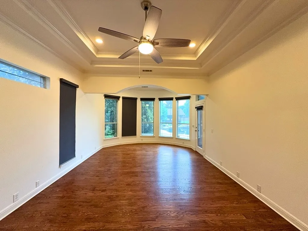Primary bedroom with tray ceiling