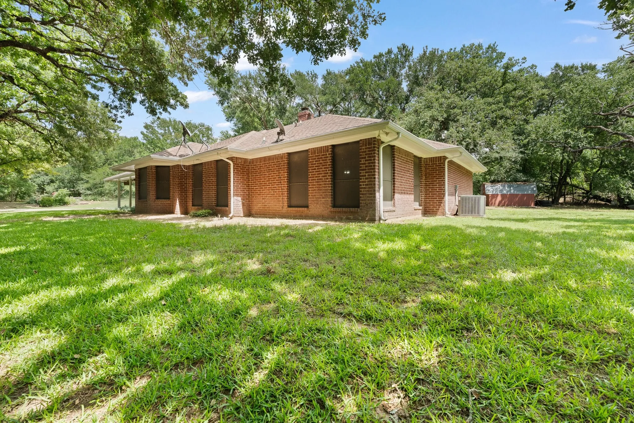 Front of the home offers views of deer amongst the trees and creek!