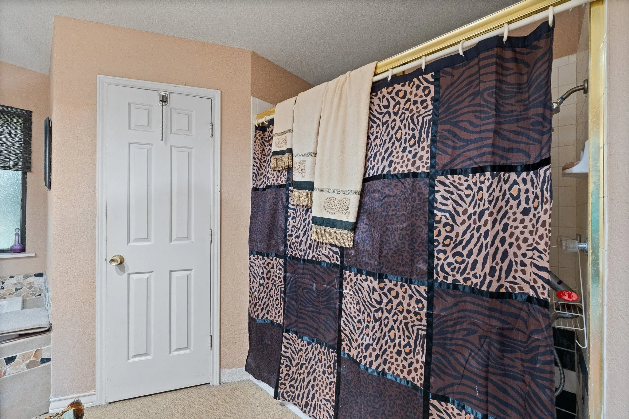 Dual closets thoughtfully positioned on both sides of the shower.