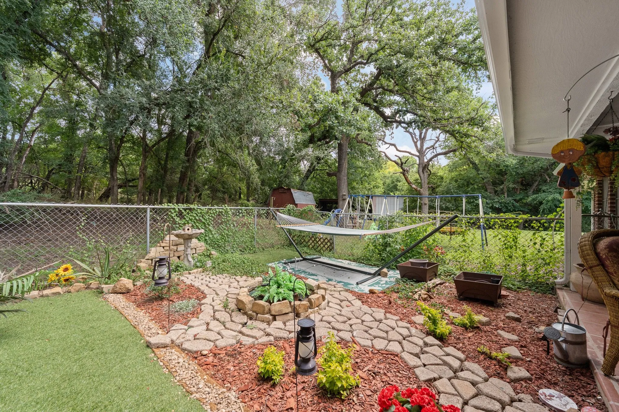 Relax in the hammock in this charming garden area.