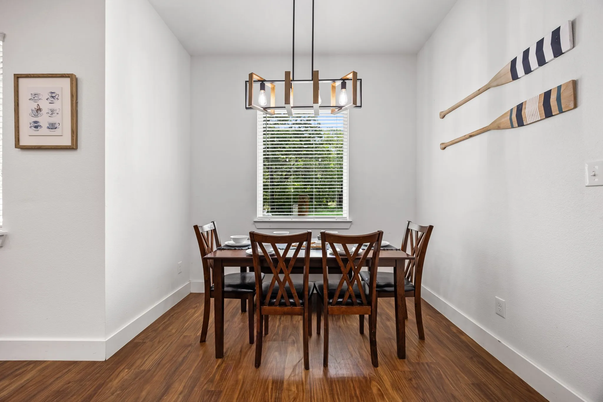 Dining area with wood-finish flooring