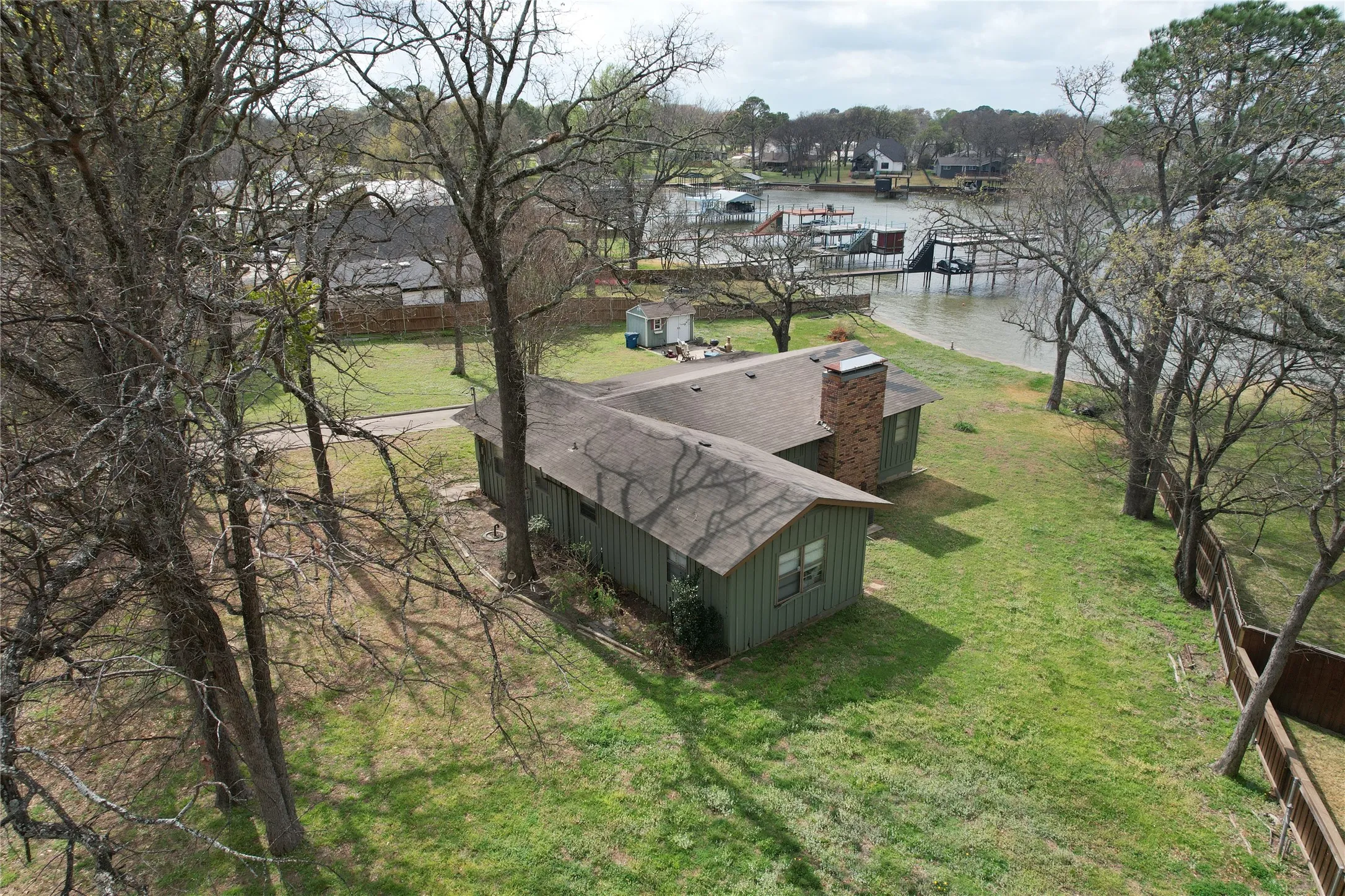 Land of Opportunity! Tear down and build your dream lake escape with elbow room, or rejuvenate old house and build guest quarters on extral lot have your own lake front retreats
on these 2 Waterfront Lots with House and OPEN WATER VIEWS for awesome sunset evenings