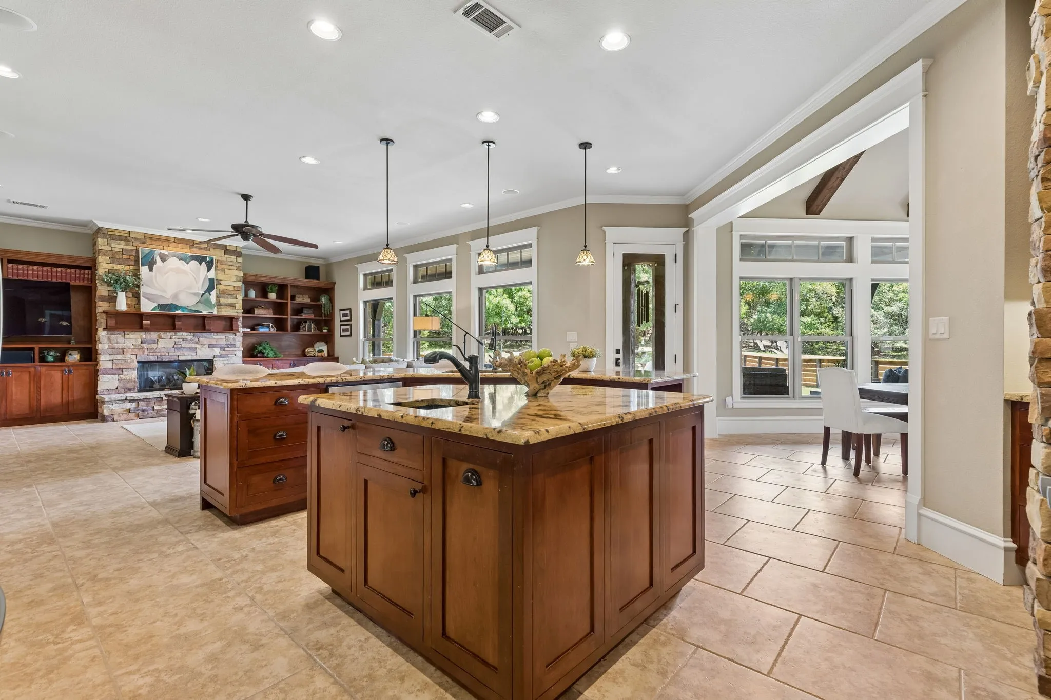 Open concept kitchen with windows to the backyard