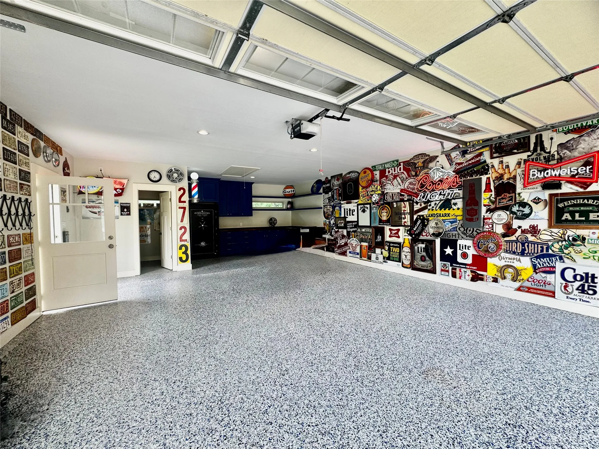 Spacious garage featuring a durable epoxy-coated floor