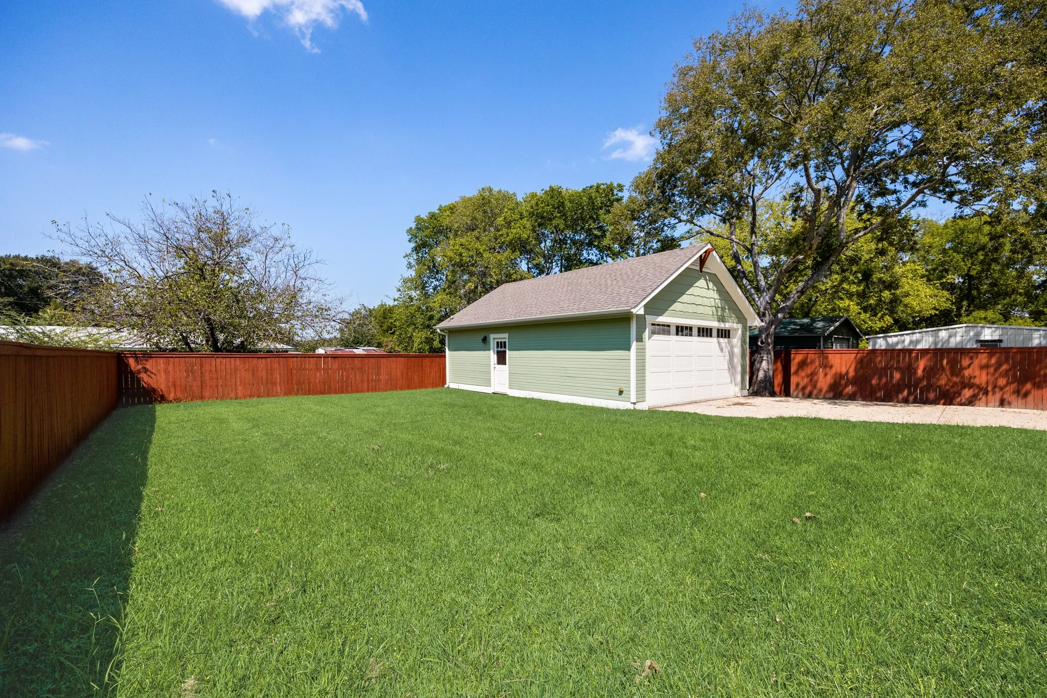 Detached 2 Car Garage with half bath,  epoxy coating, built-in cabinets,