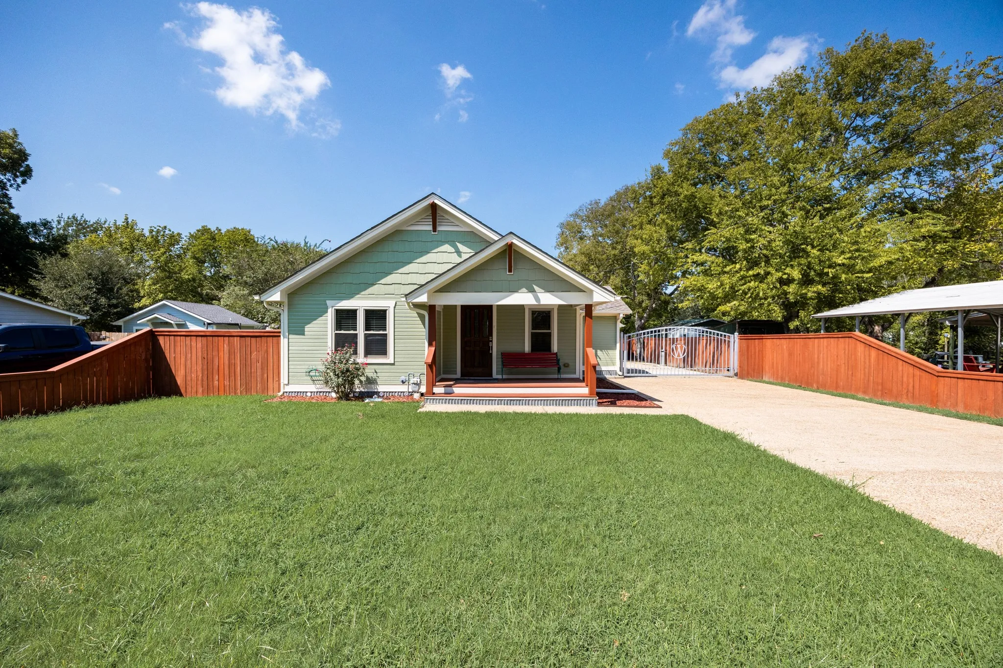 Craftsman-style exterior with mint green siding and white trim