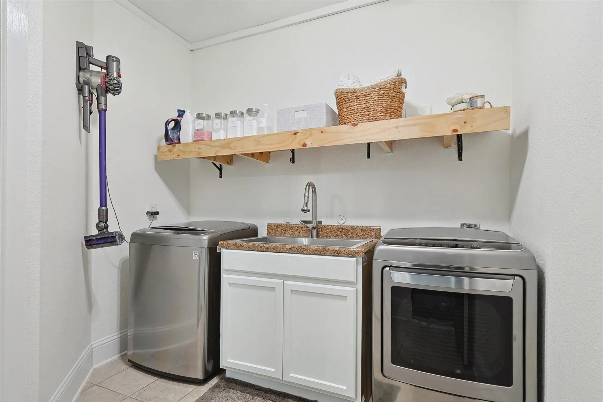 Laundry room offers utility sink. Located in main floor.