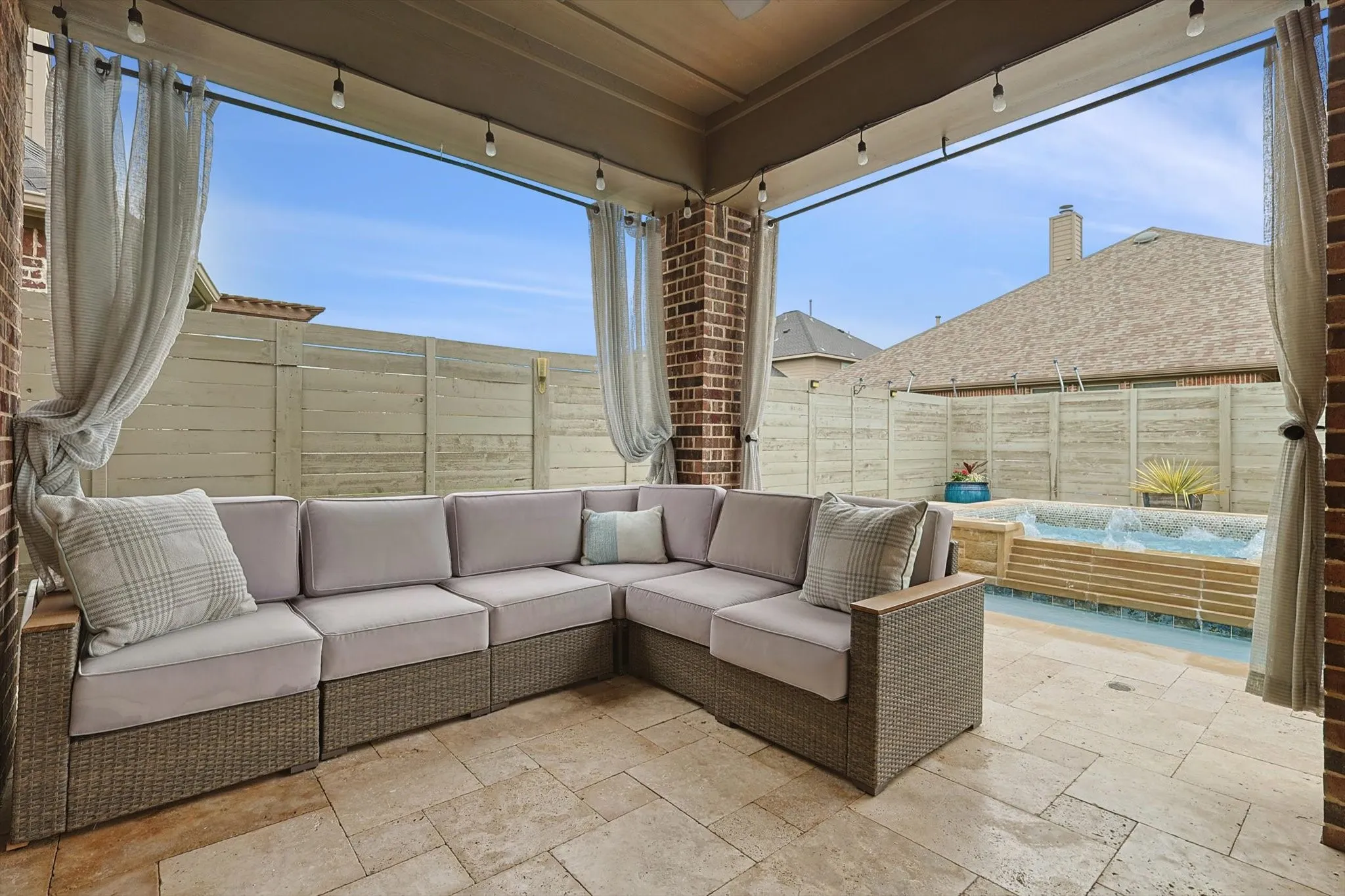 Outdoor living at its best with kitchen, eating area, and lounge space