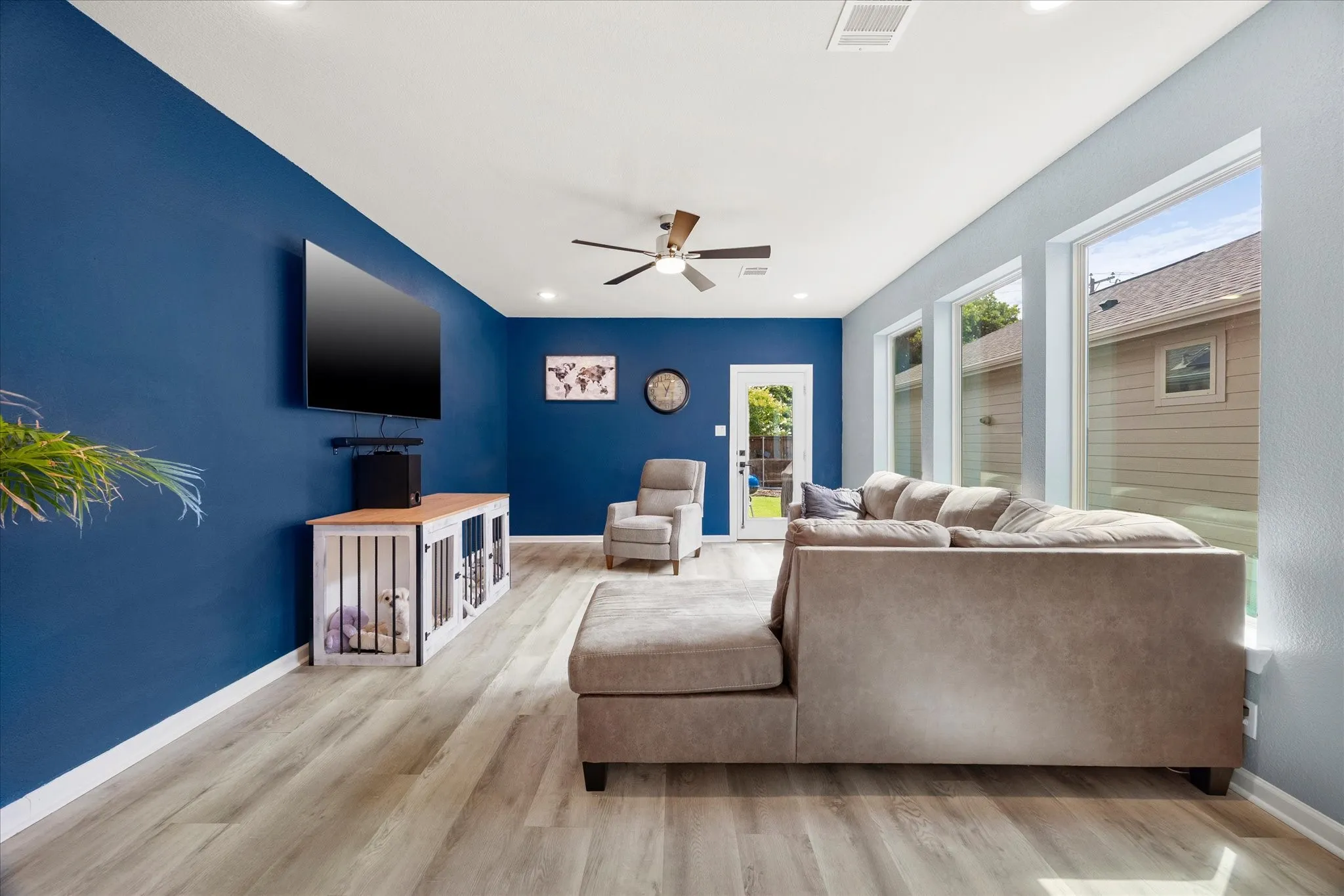 Library/Office Right off the Front Door, flooring, a dark accent wall, and multiple windows with blinds
