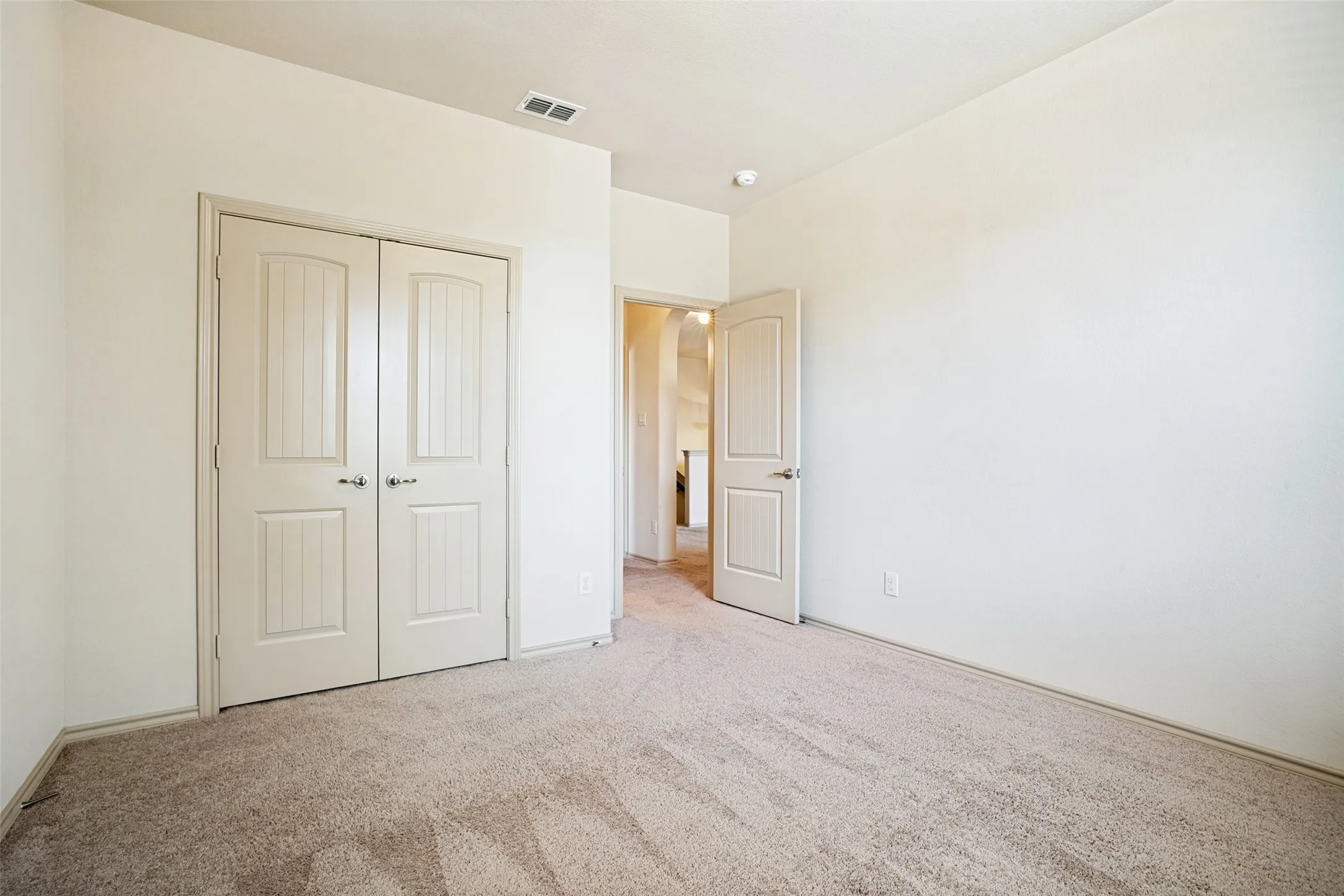 Neutral tone wall paint with light-colored carpeting