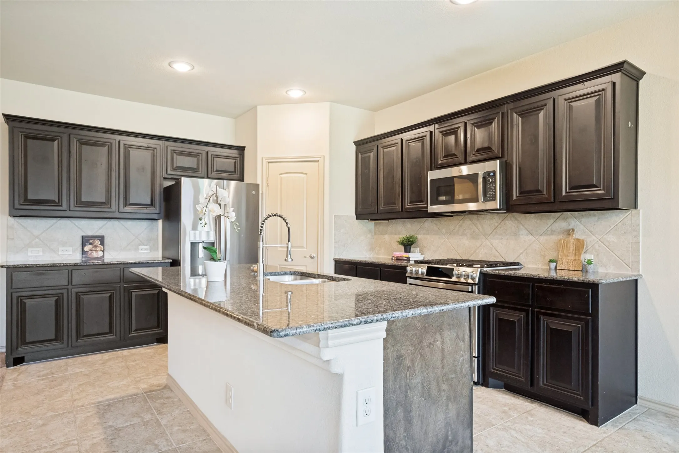 Virtually stagedRecessed lighting, ceiling fan, and carpeted flooring in an open-concept living space