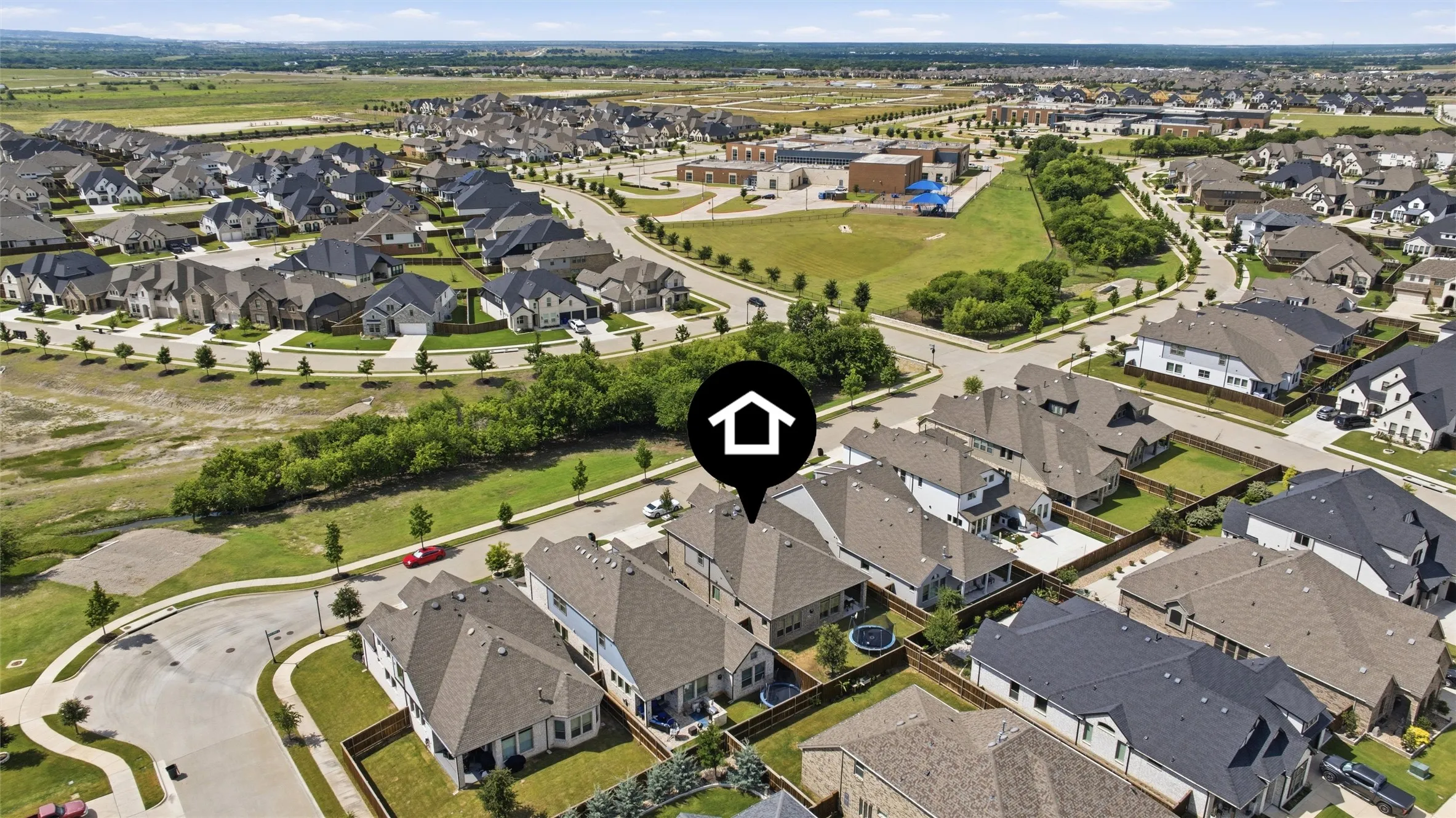 Aerial perspective showcasing a residential neighborhood with varied home designs