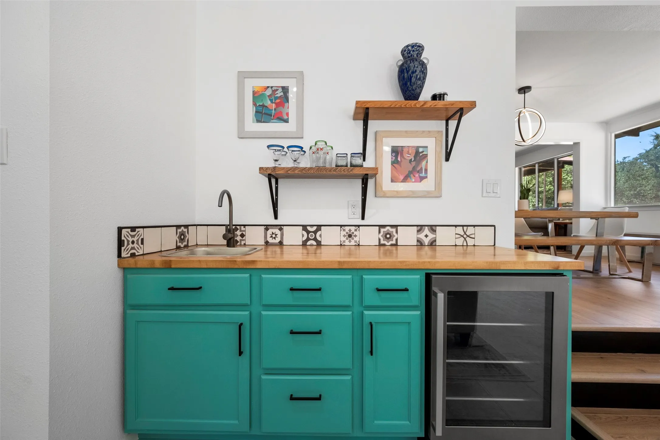 Bar with sink in entertainment room
