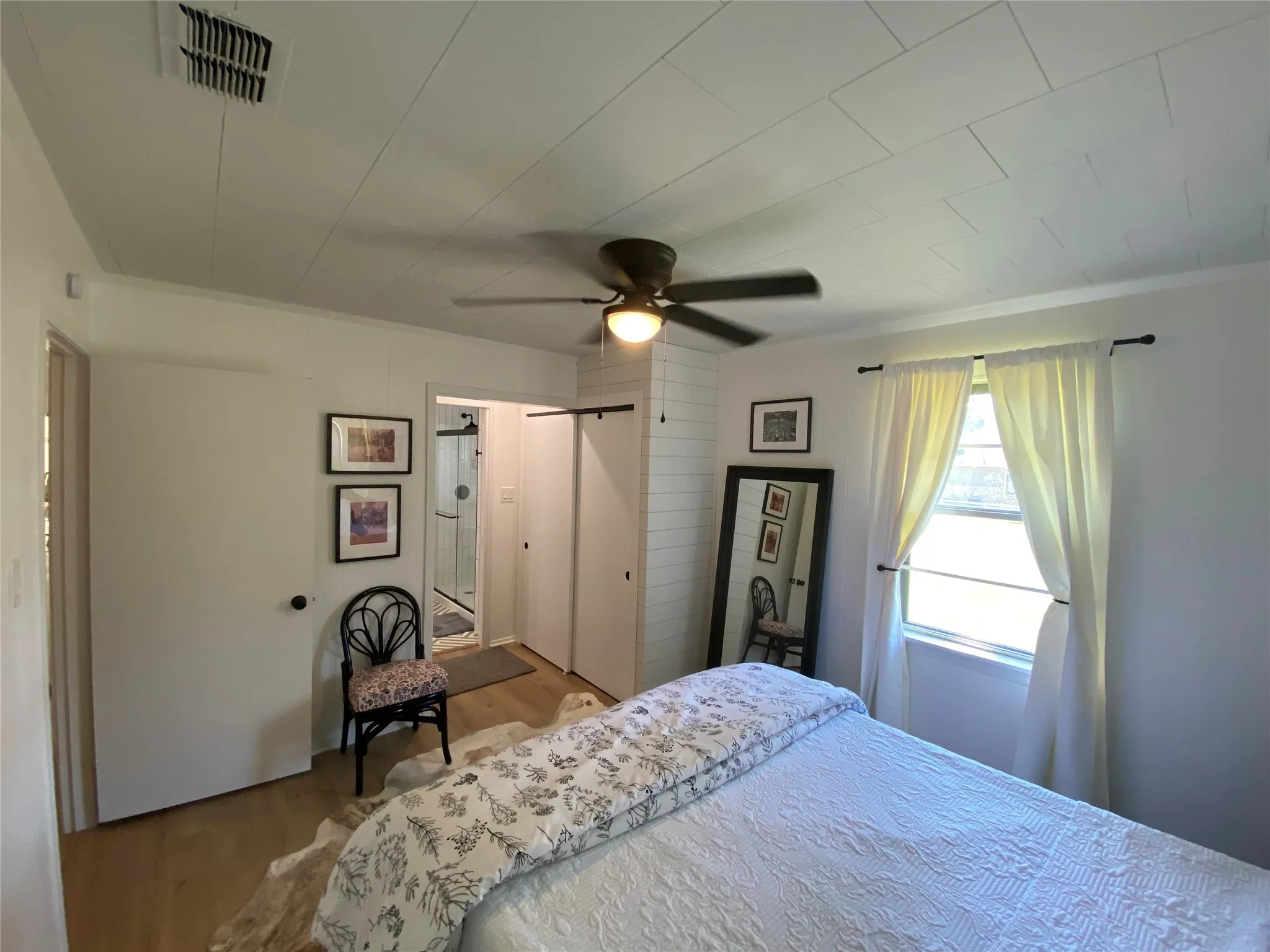 Master bedroom, large window and double closet