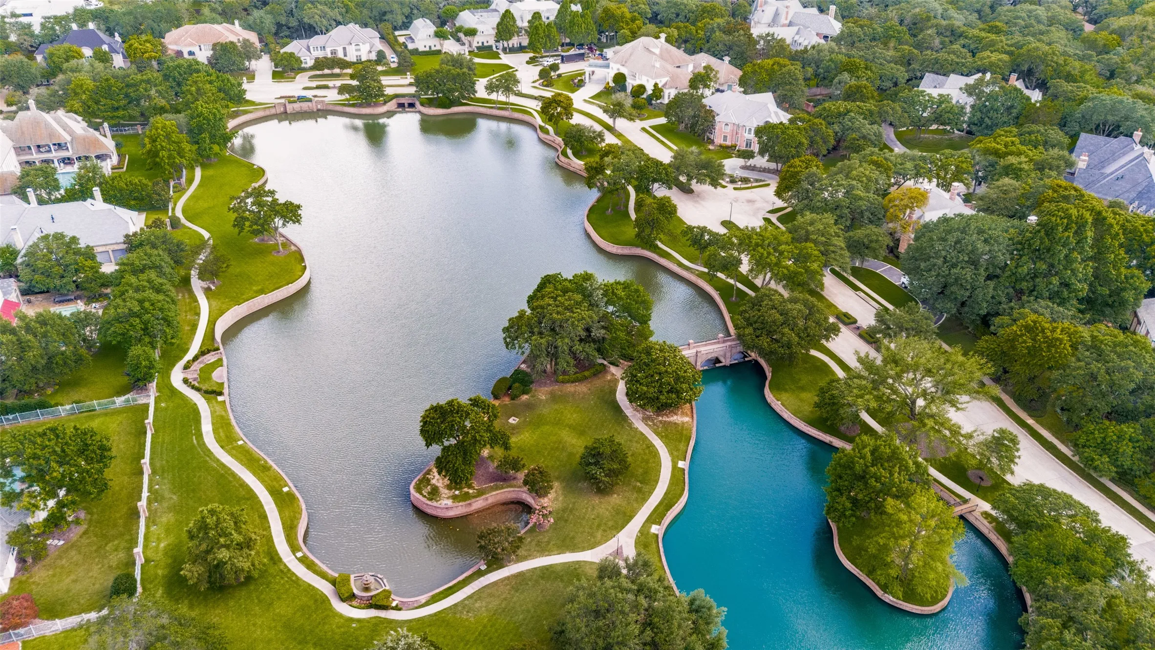 Peaceful walking trails outline water featured landscape for residents and guests of Montclair Parc.