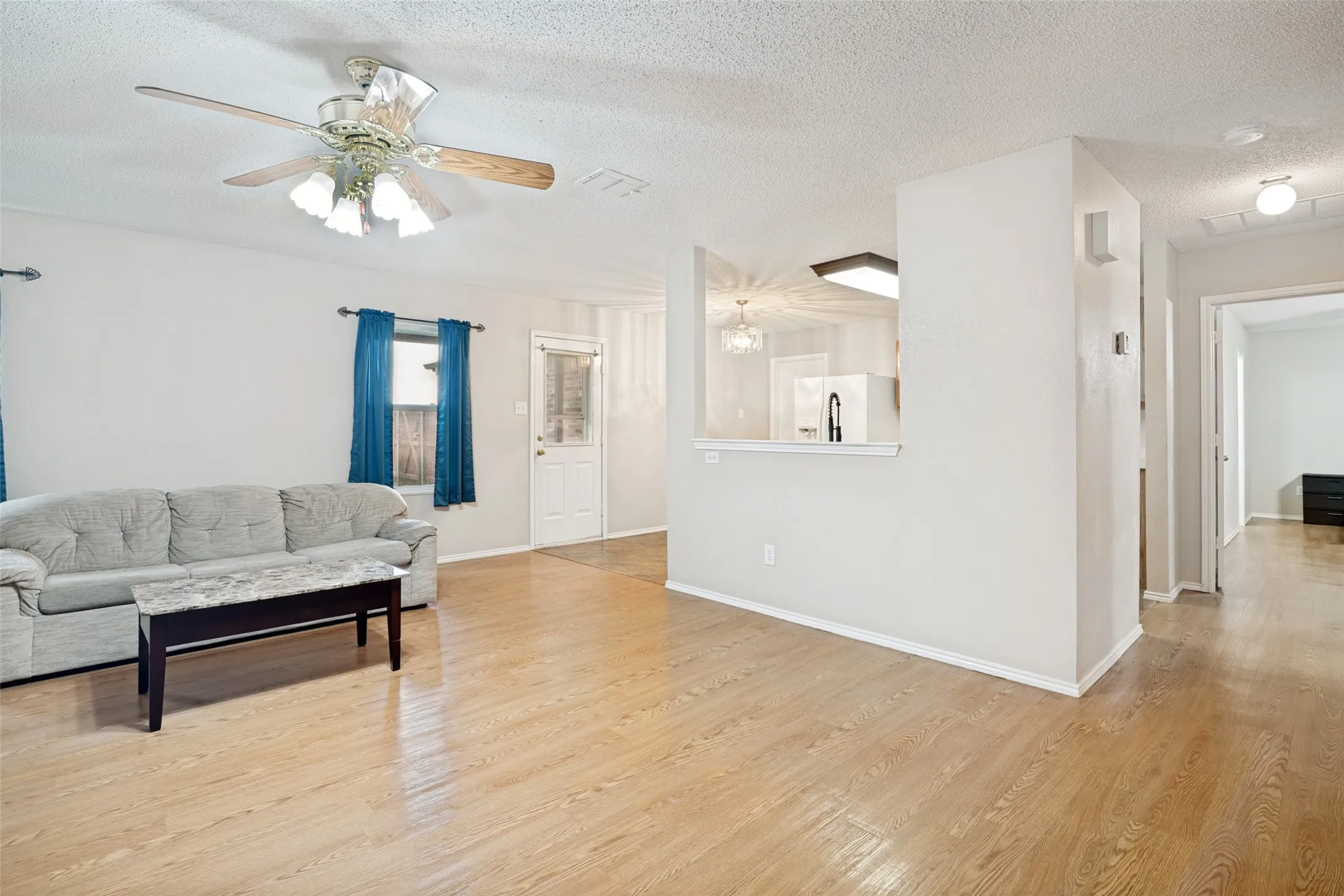 Living room is open to kitchen for ease of entertaining.