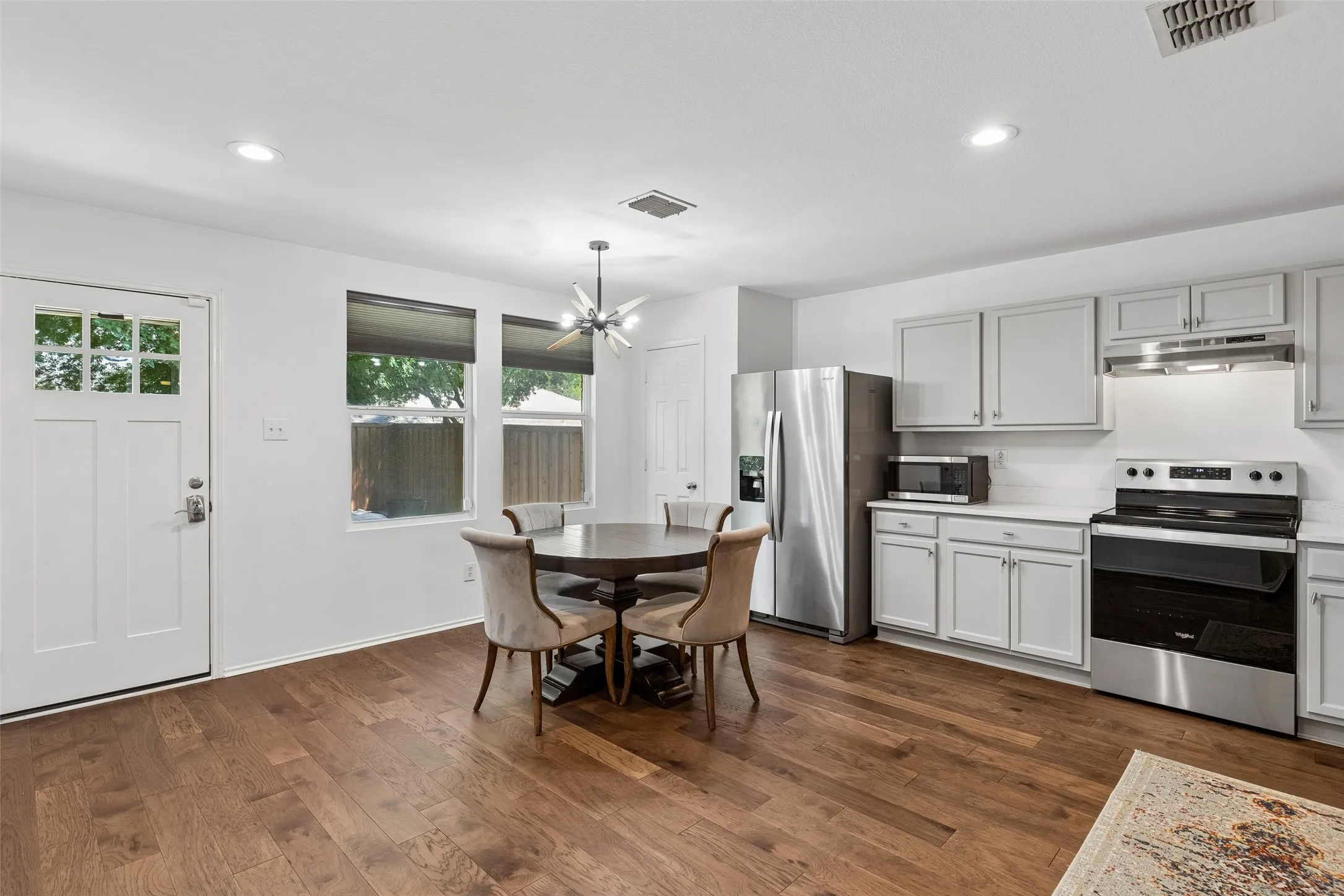 Kitchen updated with quartz countertops, fresh paint and new hardware.