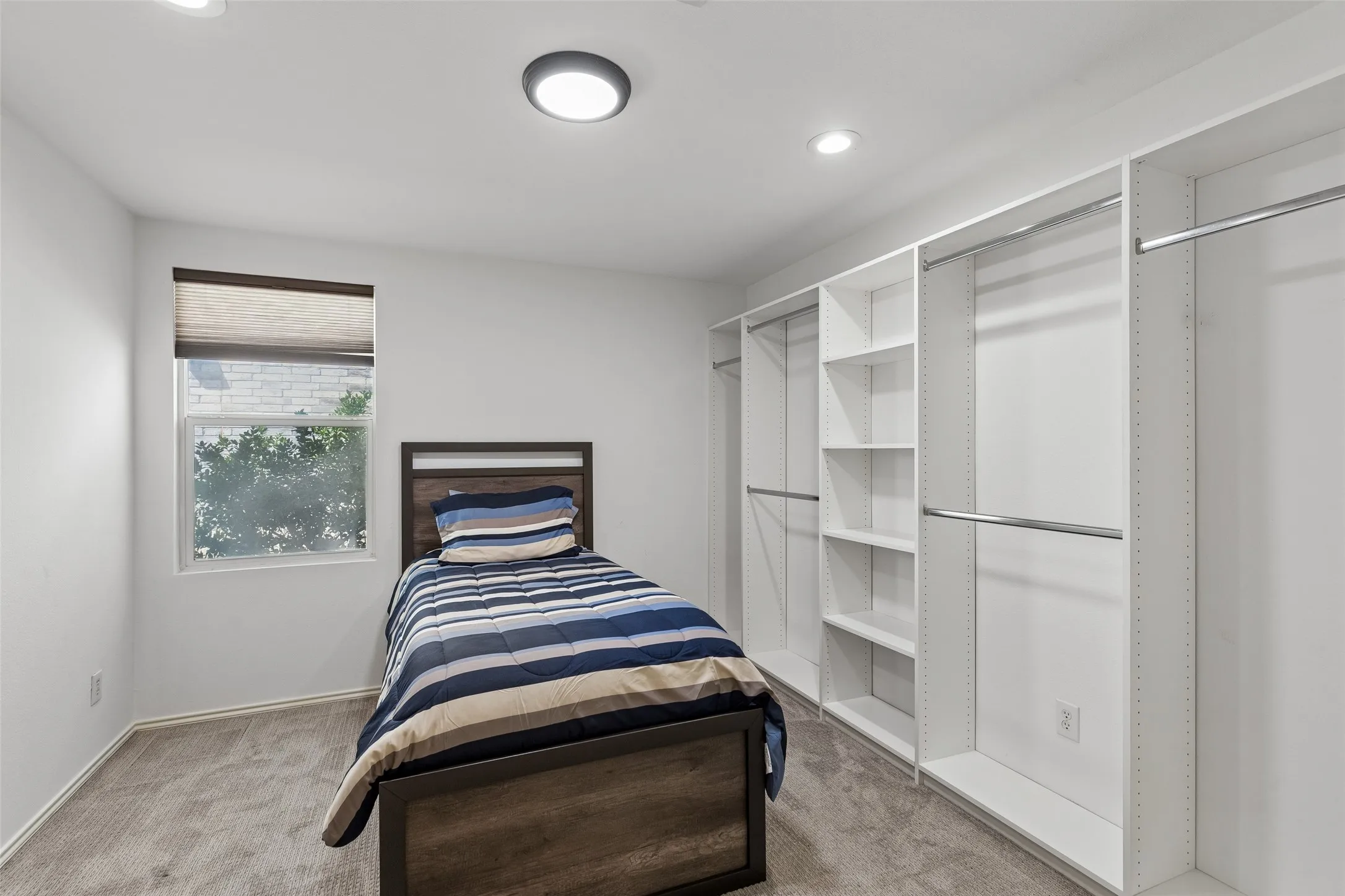 Secondary bedroom with built in shelving