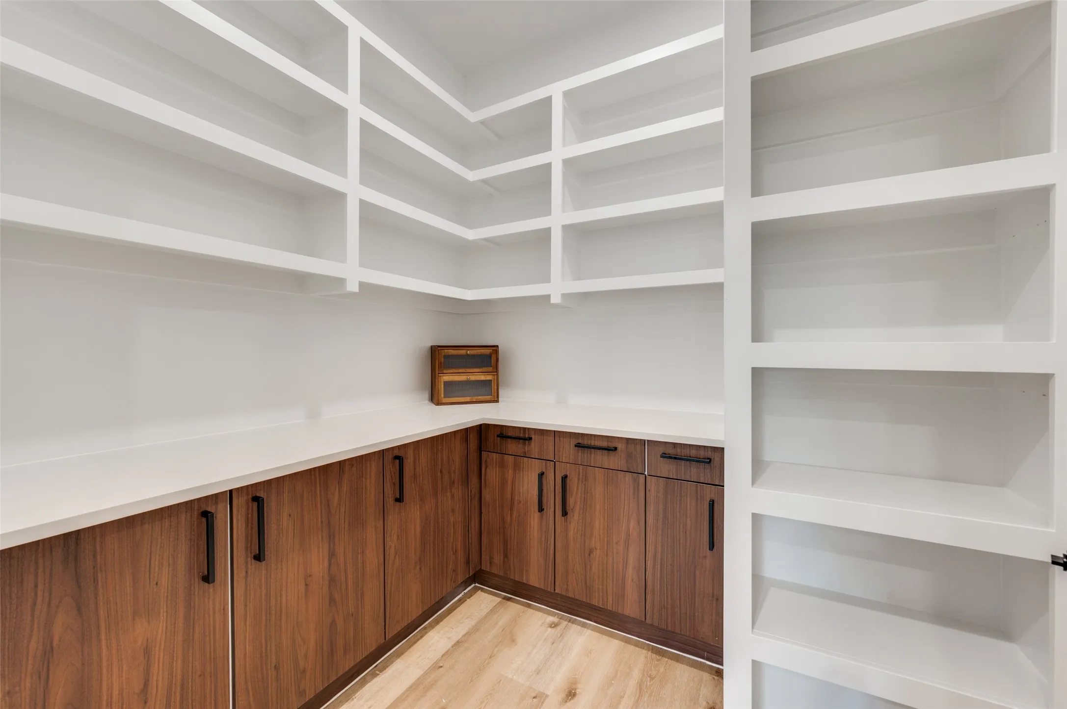 Built-in custom shelving and cabinetry offering extensive storage
