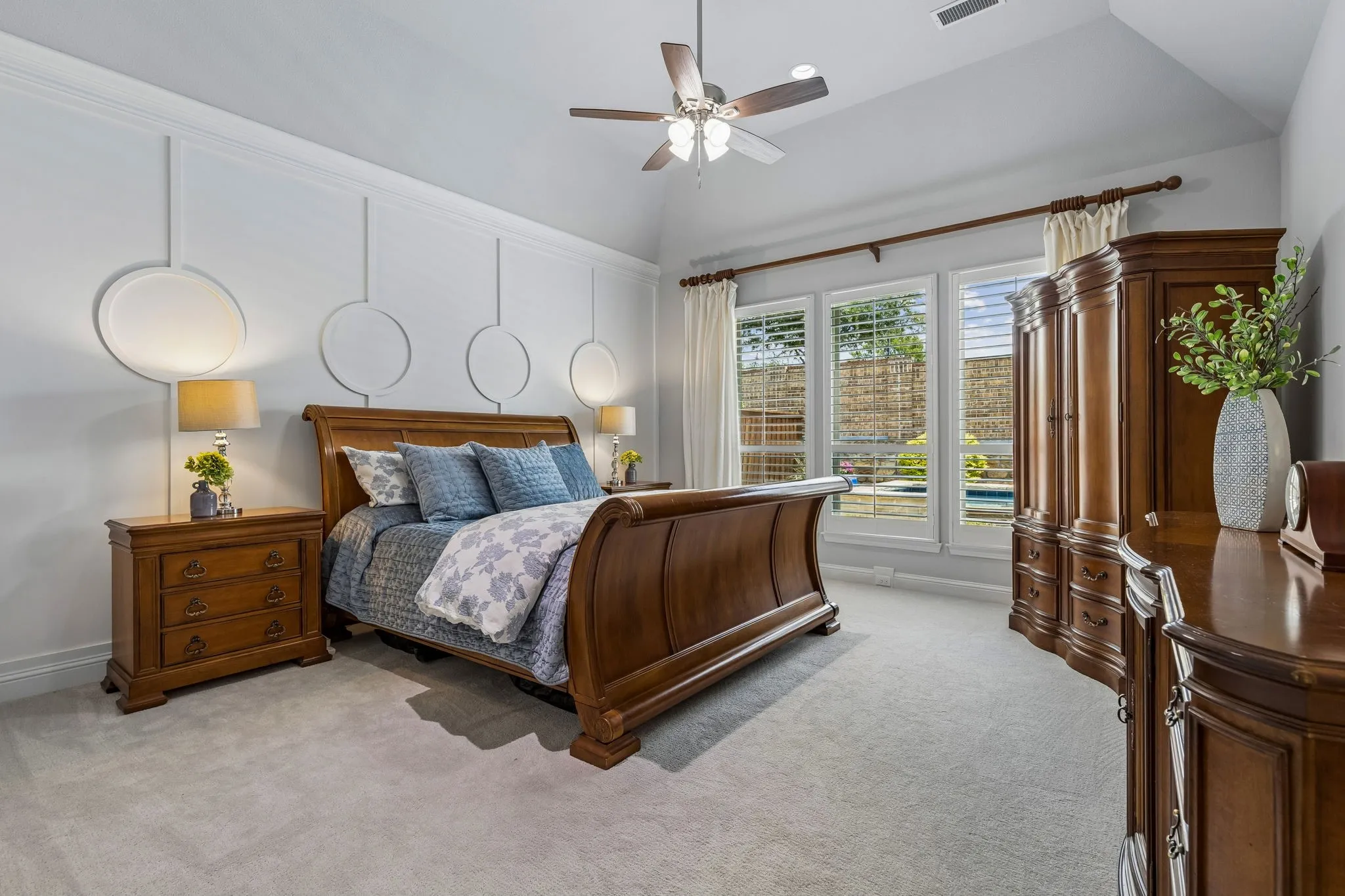 Primary suite with room for large furniture. Accent wall adds the designer touch.