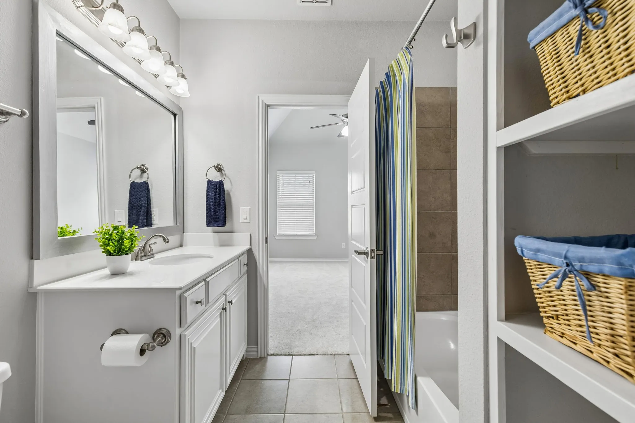 Ensuite bath for bedroom 3 upstairs. Built in shelves for extra storage.