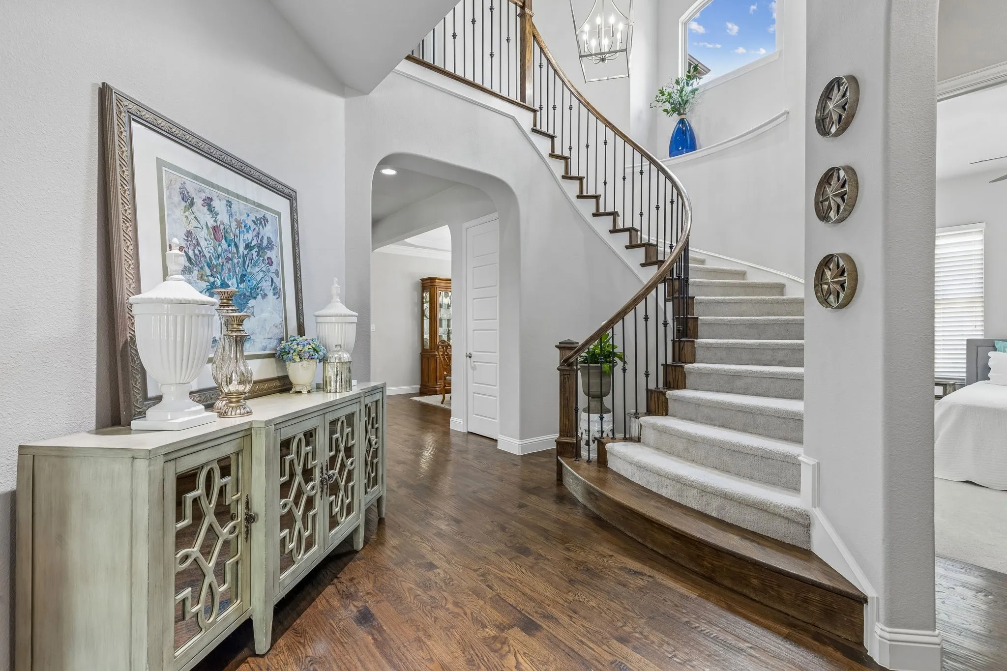 Spiral staircase ennhances the entry