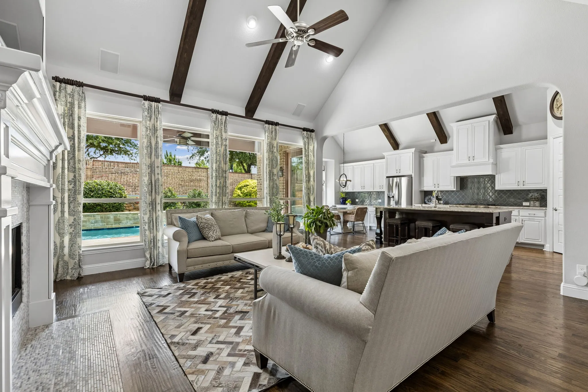 Family room with cathedral ceiling enhance with exposed beams