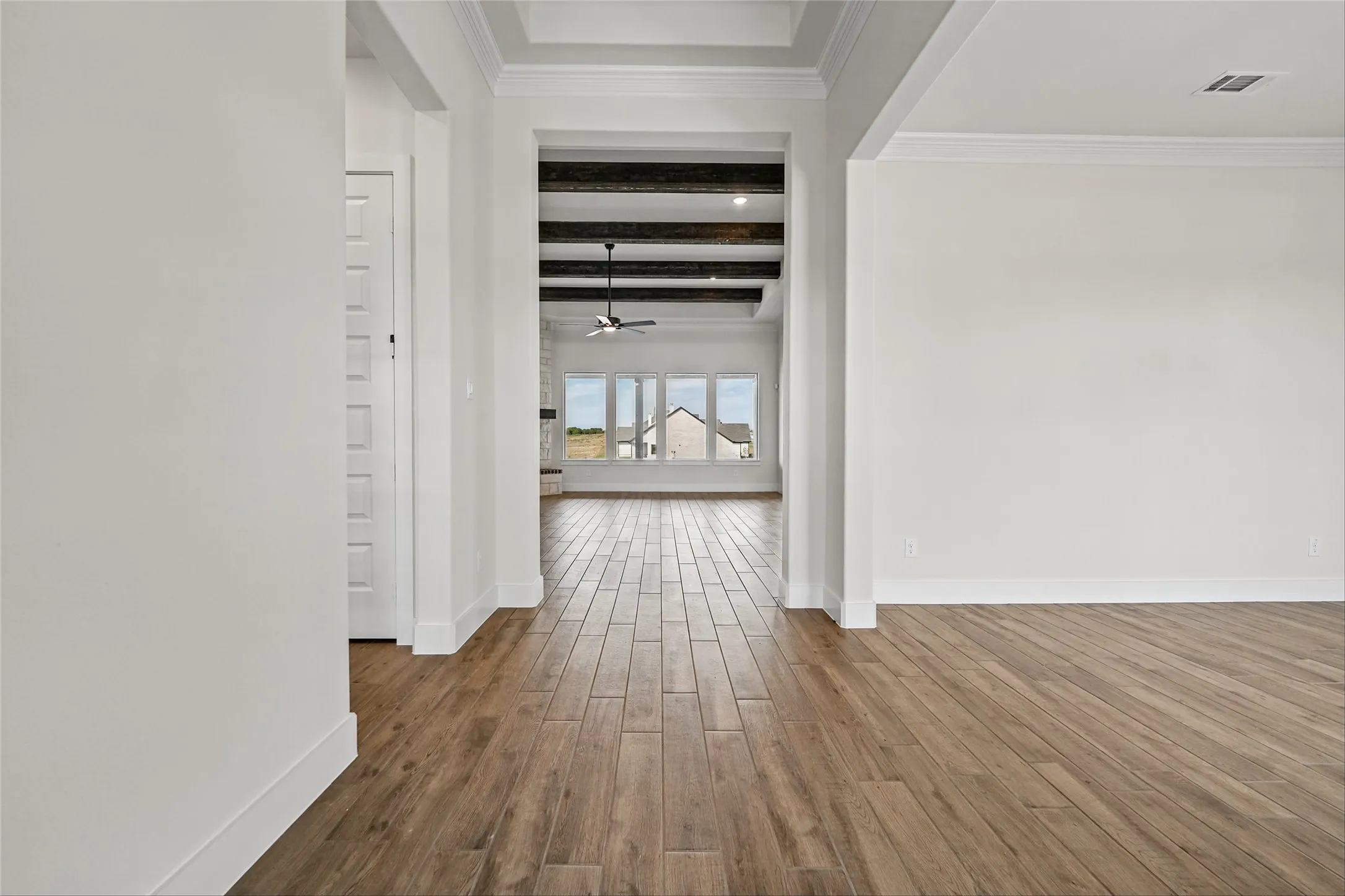 Wood-finish plank flooring throughout
