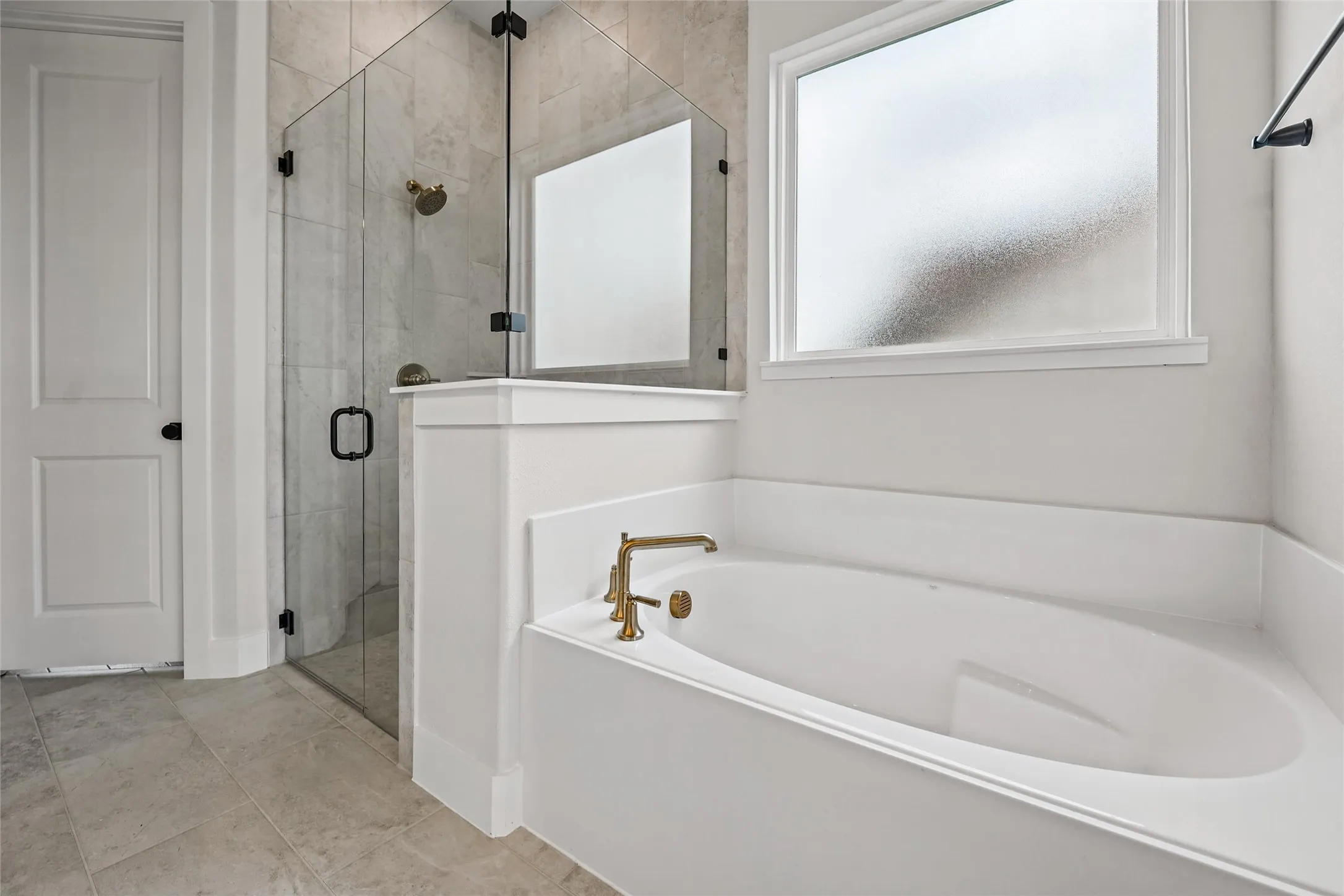 Built-in soaking tub with brass fixtures