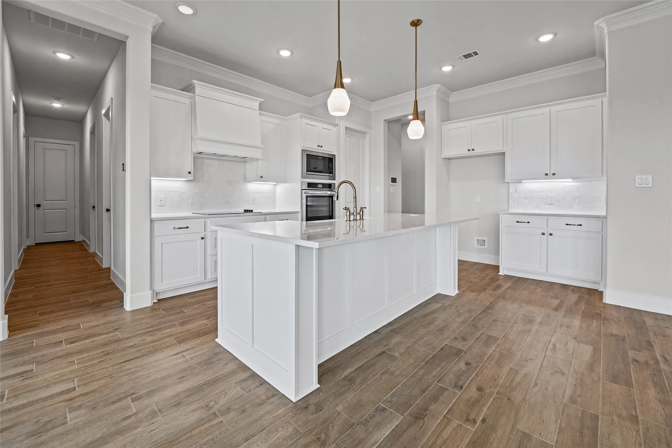 Expansive kitchen island with a white countertop and seating