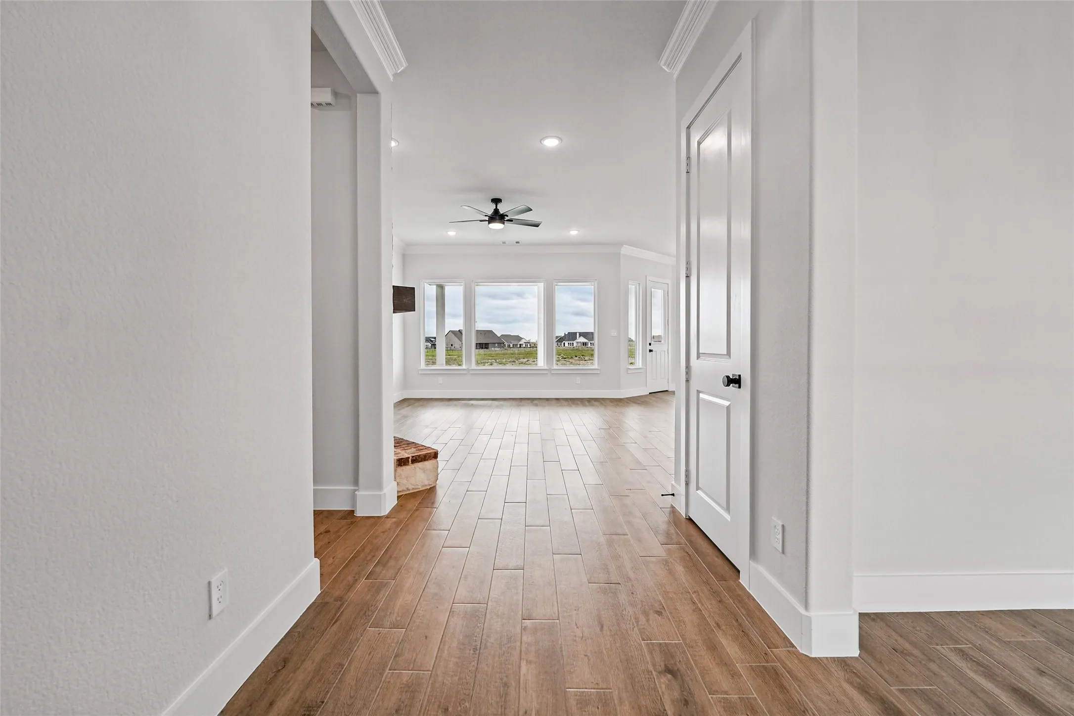 Wood-finish plank flooring throughout