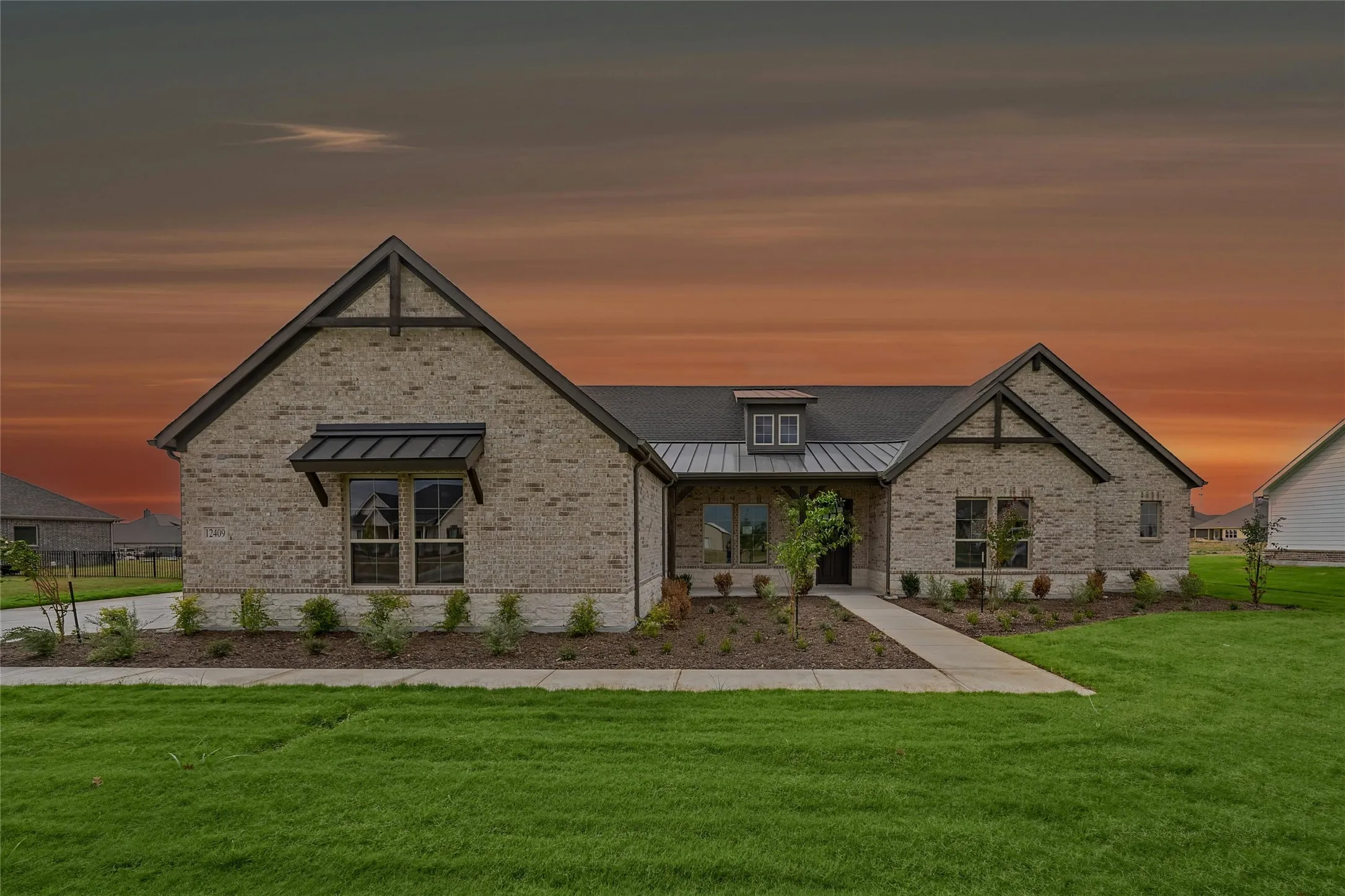 Brick exterior with stone accents and dark trim detailing
