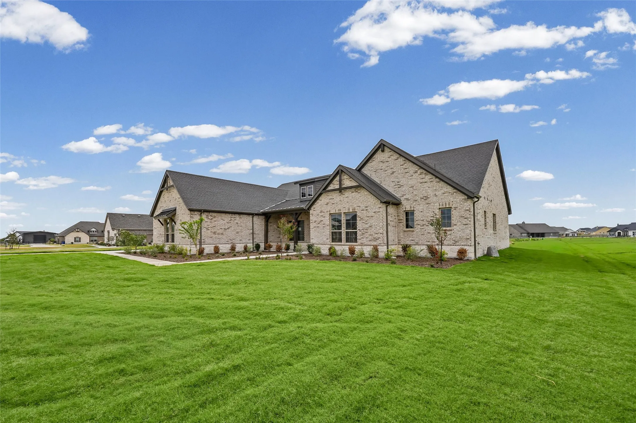 Stone brick exterior with dark trim and a gabled roofline