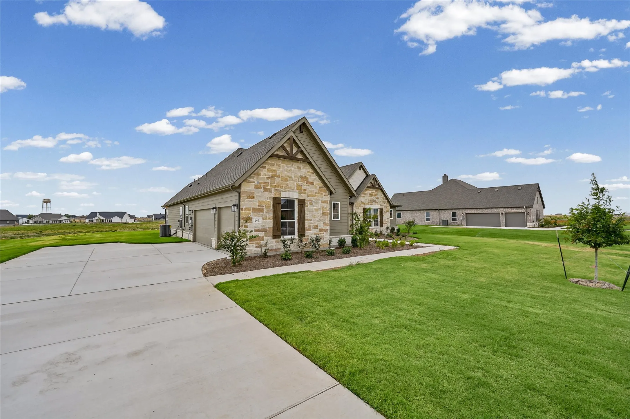 Stone and siding exterior with gabled roof lines