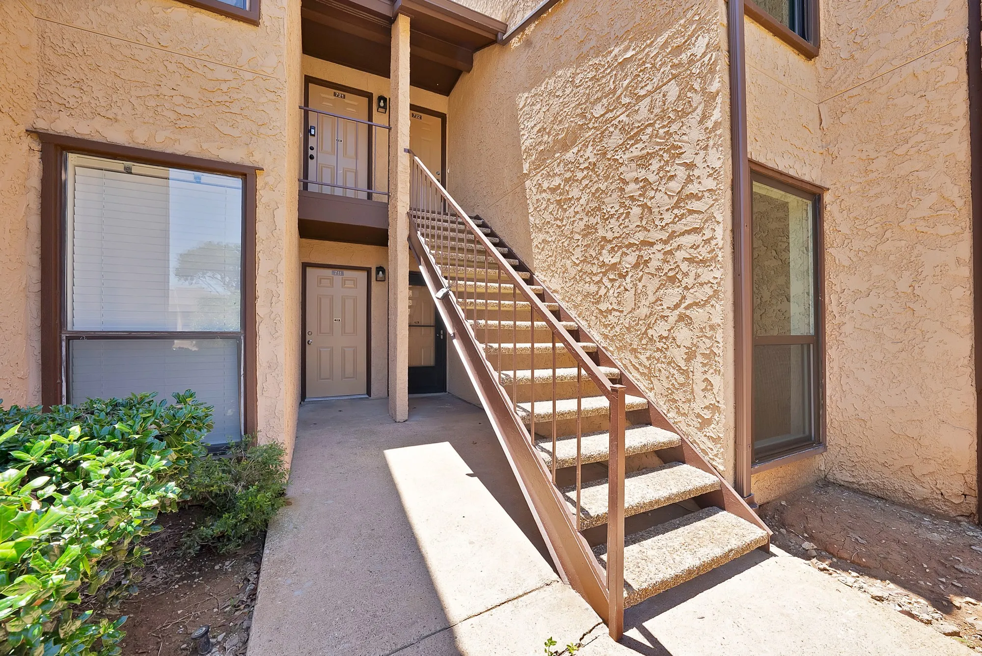 walk up to the condo, condo is on the ground floor with screen door