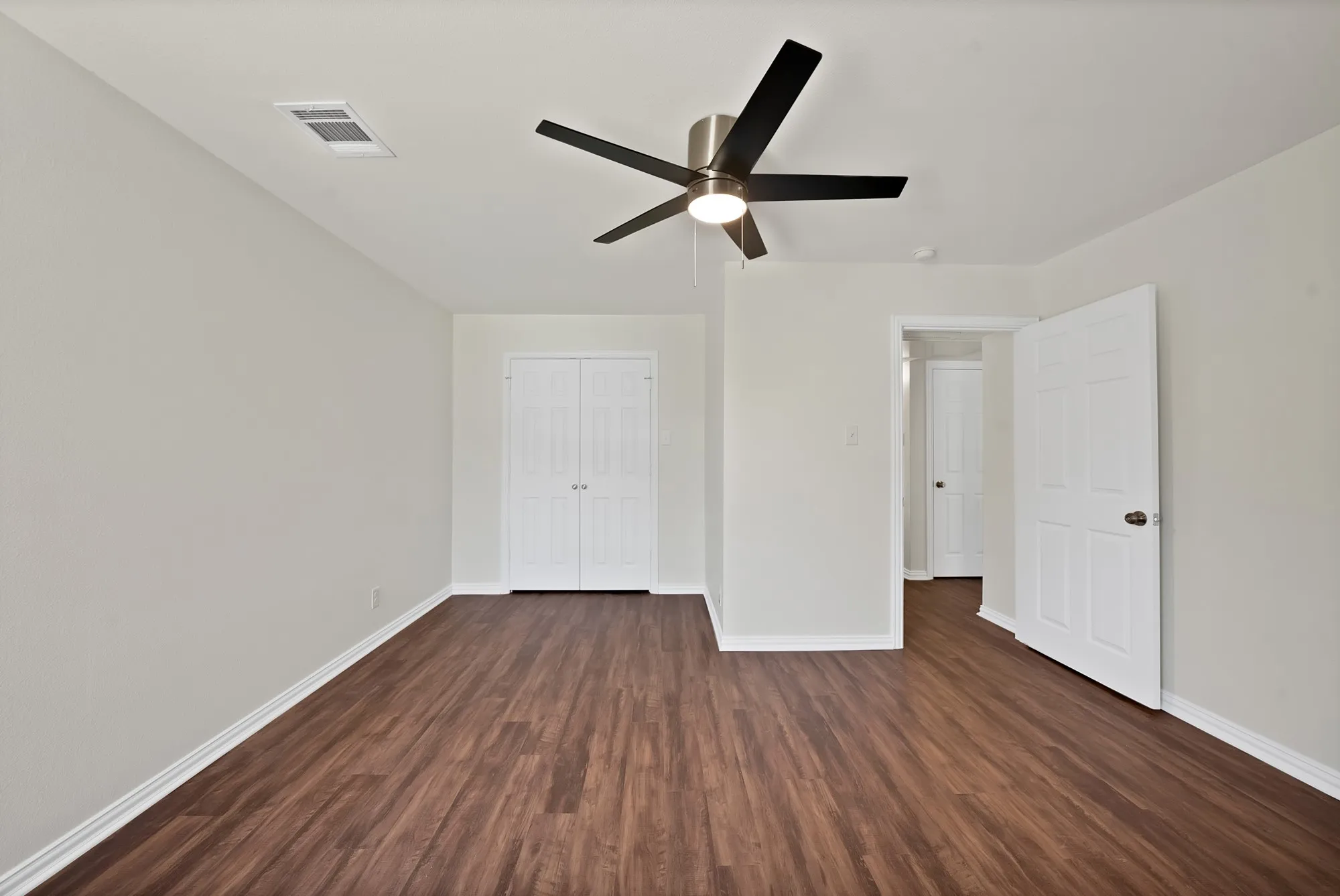 another view of the primary bedroom