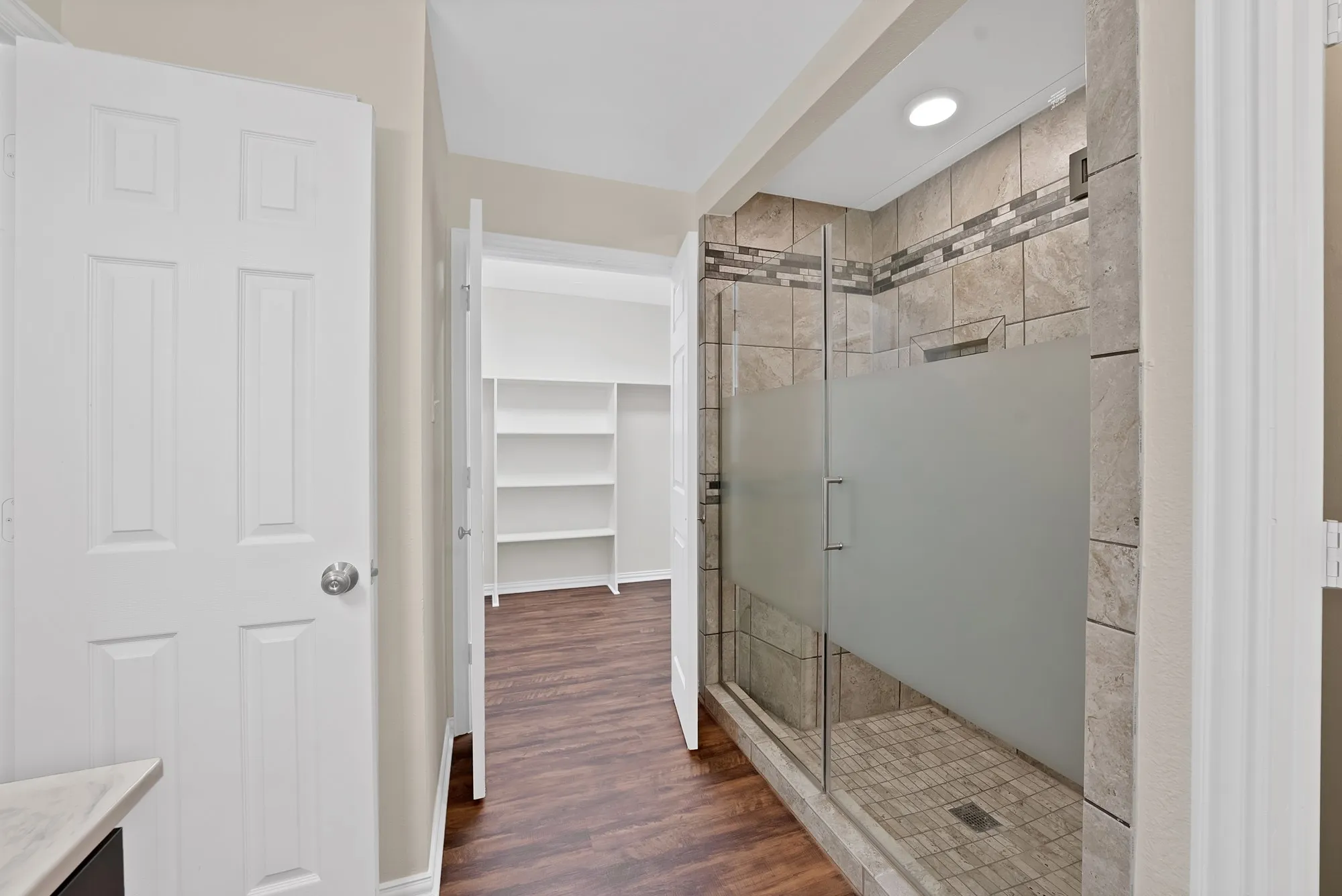 walk in closet is connected to primary bathroom